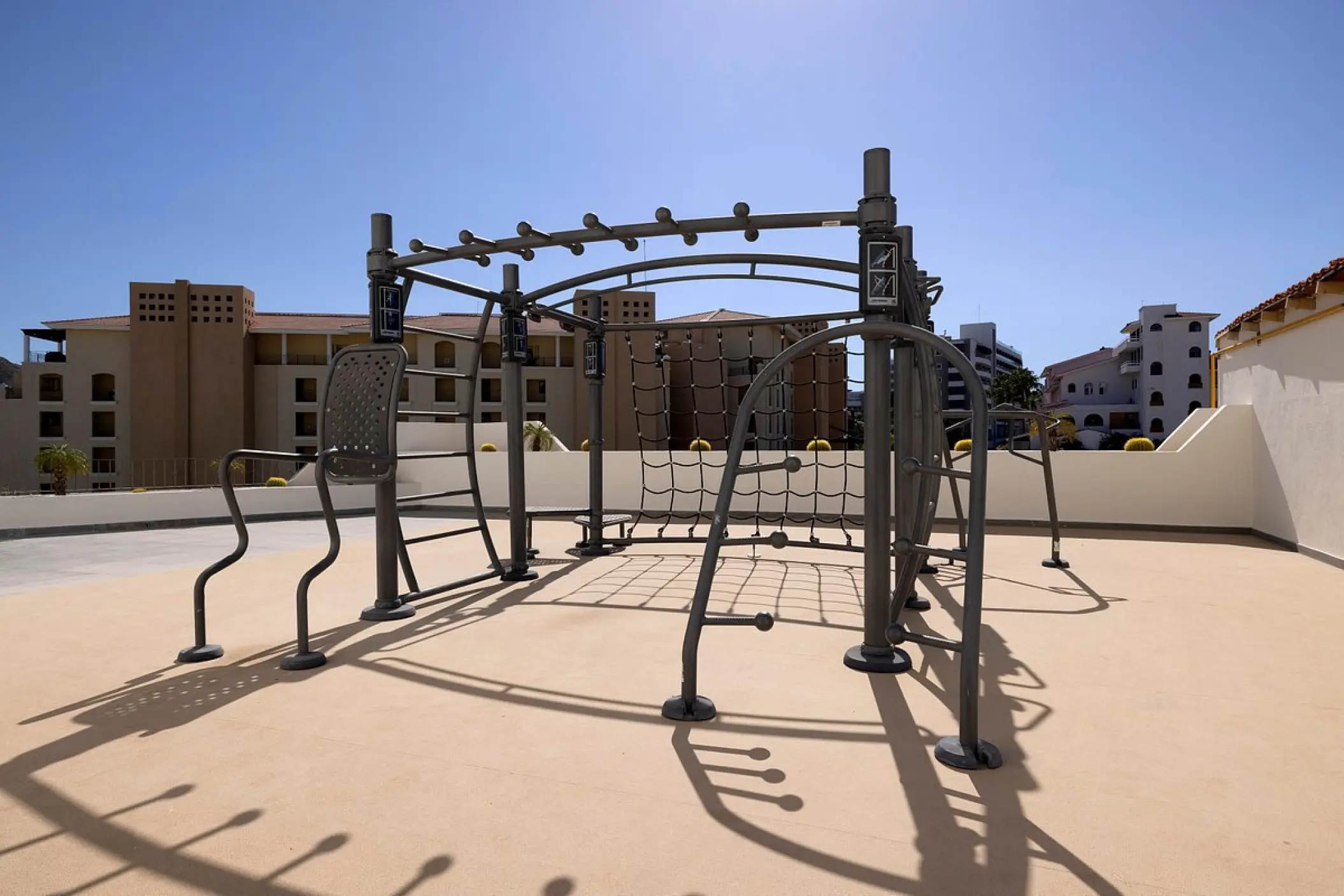 Outdoor jungle gym fitness equipment on a rooftop terrace at ME Cabo, Cabo San Lucas