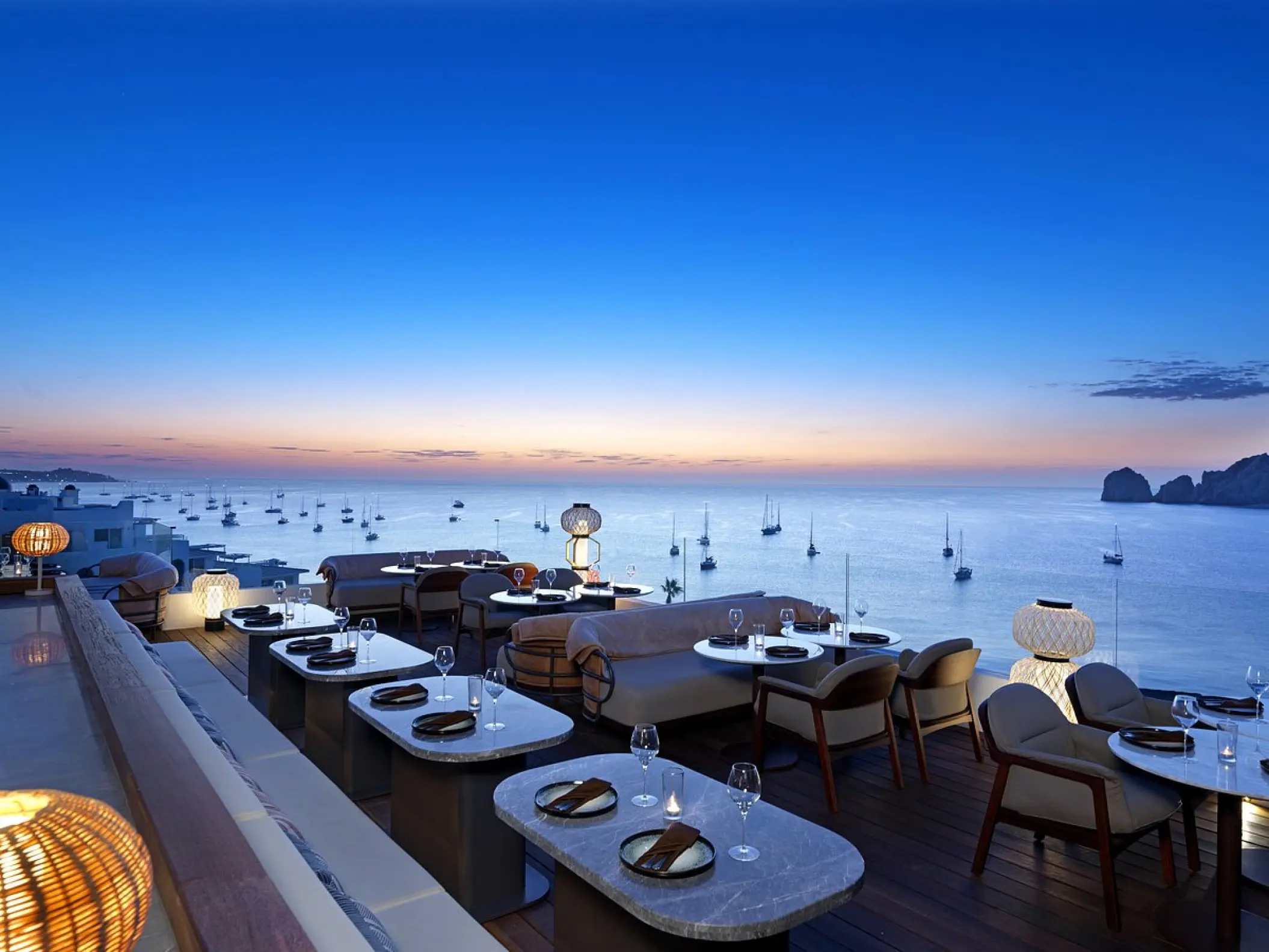 Confessions rooftop terrace at ME Cabo overlooking the ocean at sunset, Cabo San Lucas