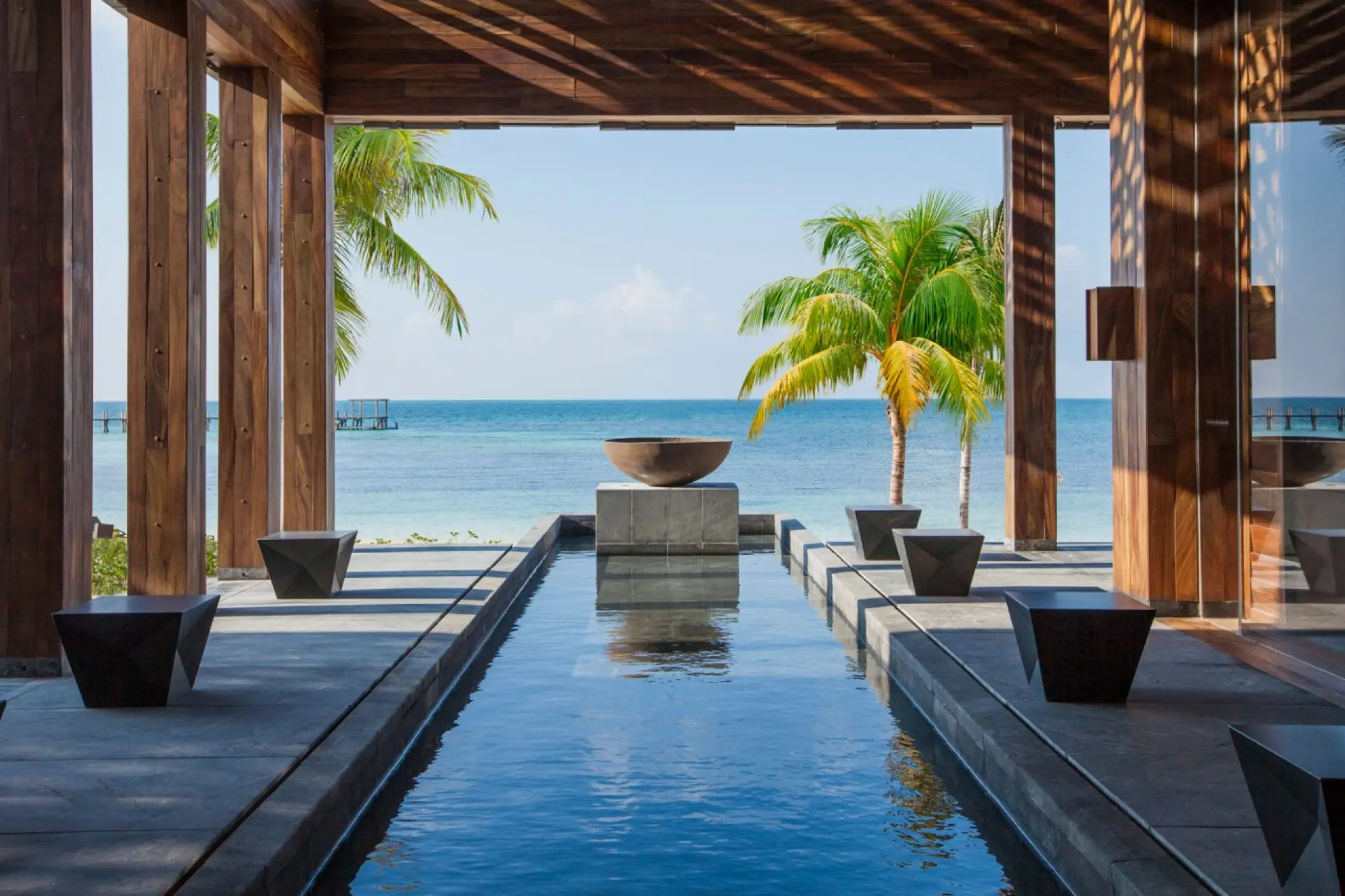 Modern reflection pool and ocean view at Nizuc Resort, Cancun