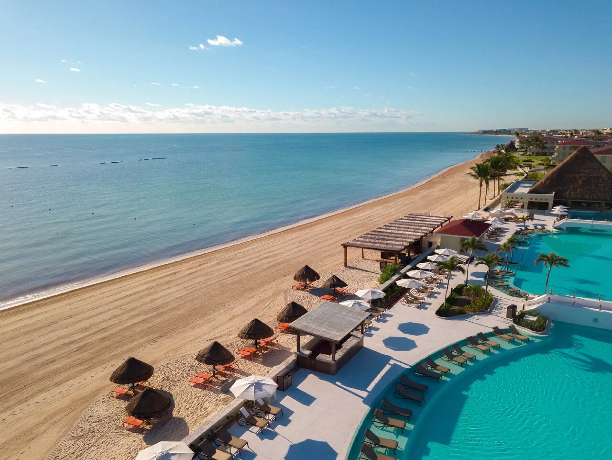 Aerial view of the beach and swimming pools at Moon Palace Cancun