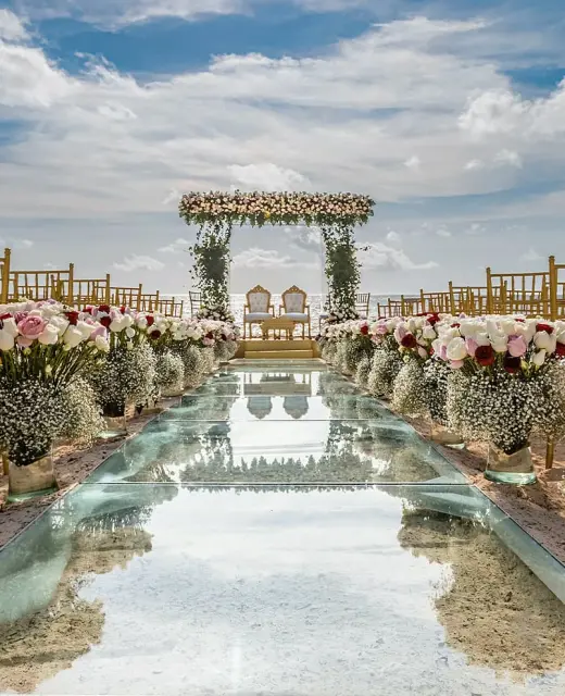Ceremony decor in beach wedding venue at Moon Palace Resort