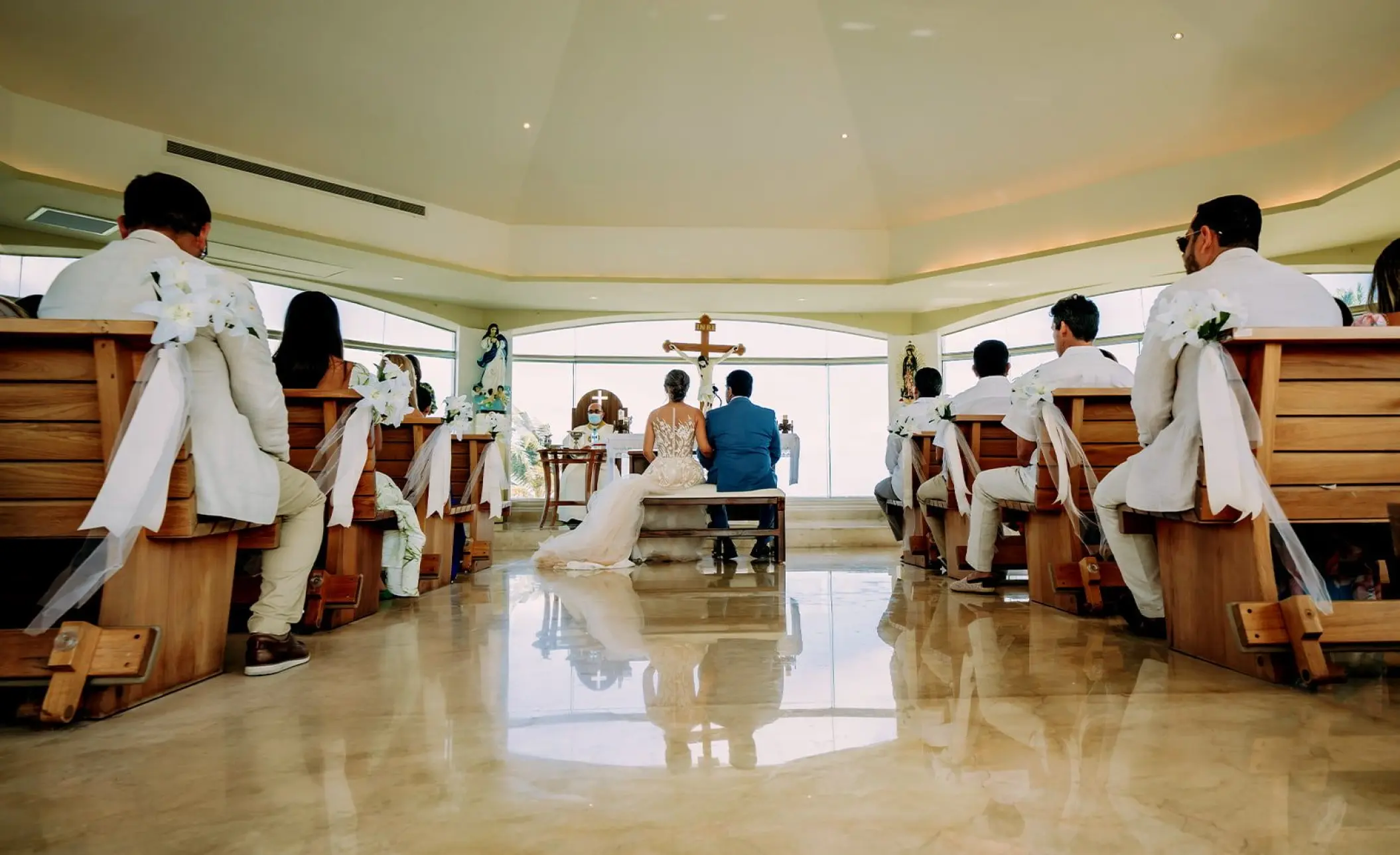 Catholic wedding ceremony in the glass-walled chapel at Moon Palace Cancun