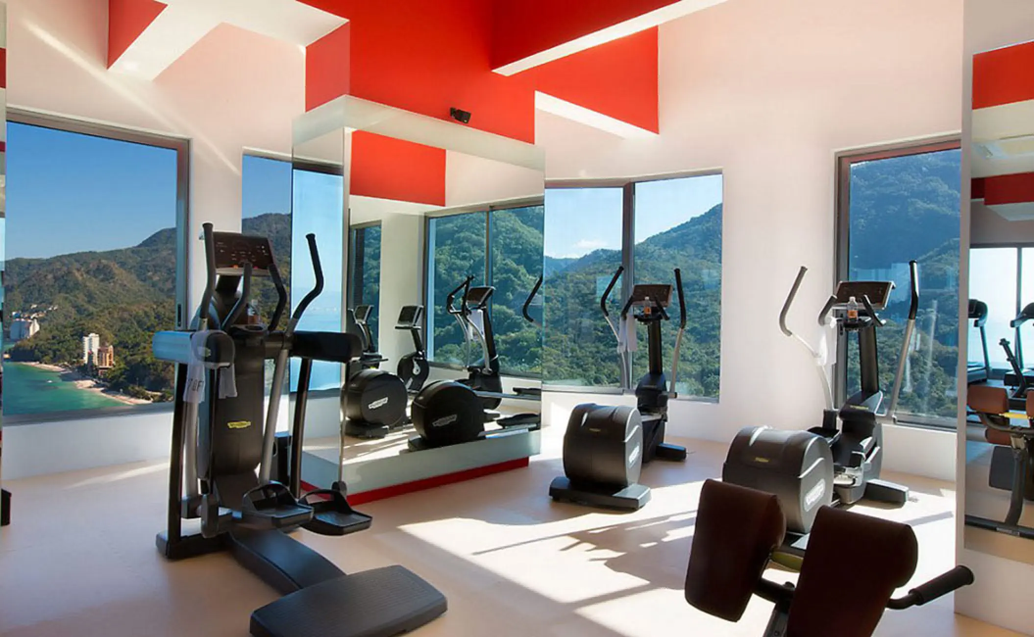 Hotel Mousai fitness center with cardio equipment and jungle views, Puerto Vallarta