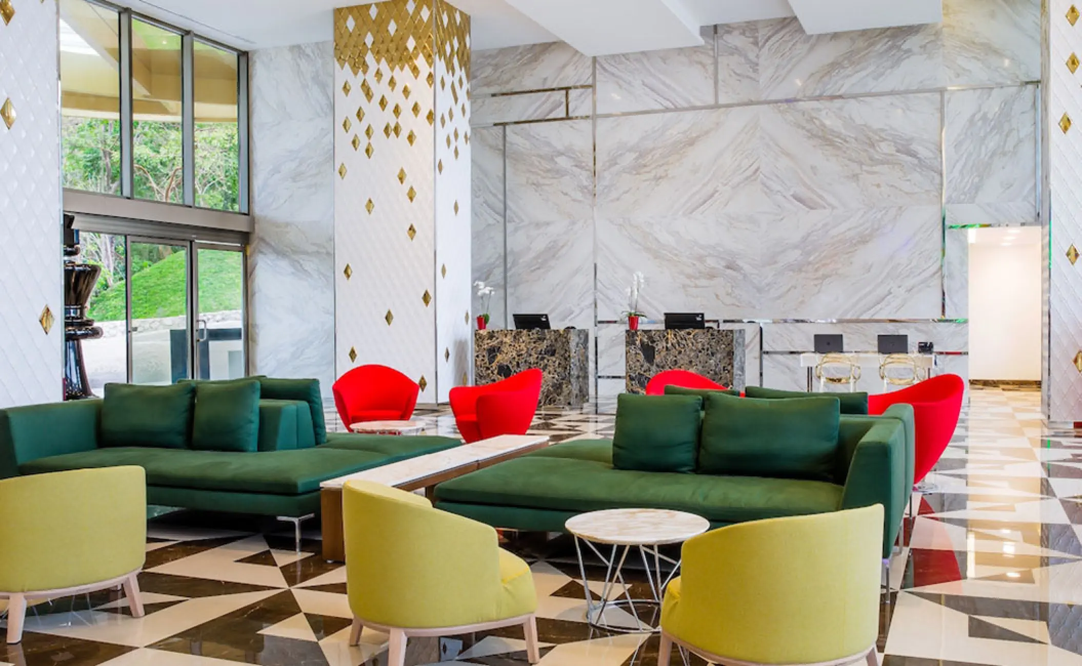 Hotel Mousai South lobby with colorful seating and marble walls, Puerto Vallarta