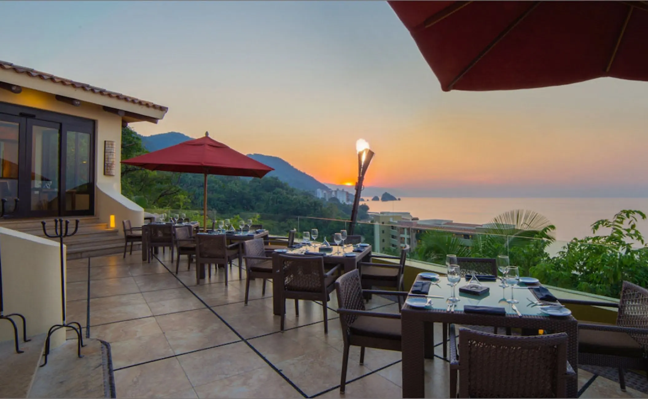 Bocados Steak House terrace at sunset with Pacific Ocean views at Hotel Mousai, Puerto Vallarta
