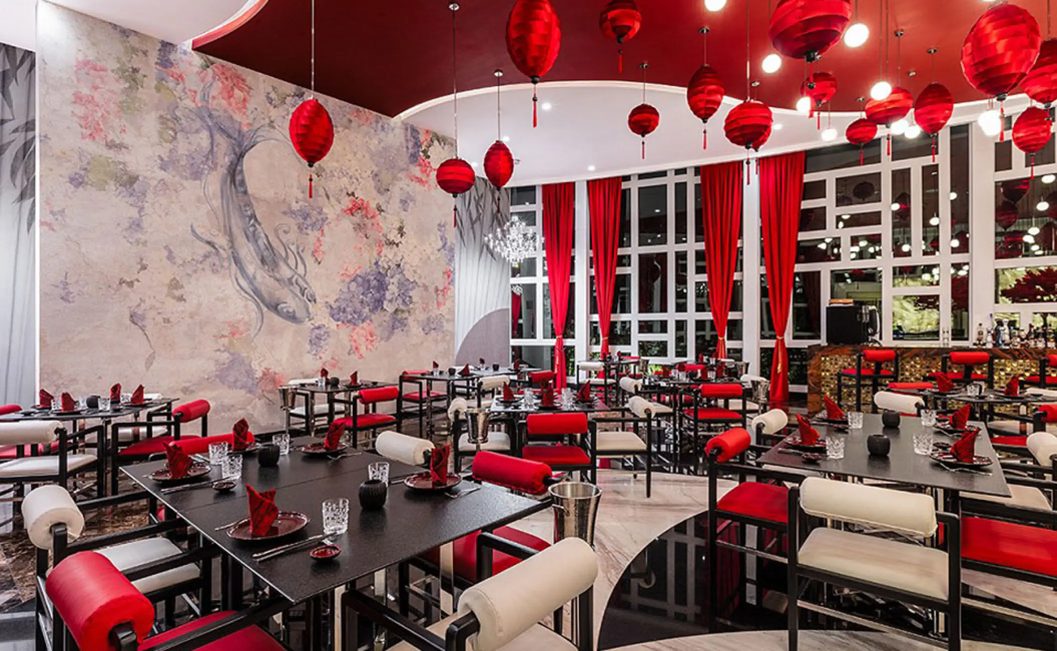 Dao restaurant interior with red paper lanterns and mural at Hotel Mousai, Puerto Vallarta