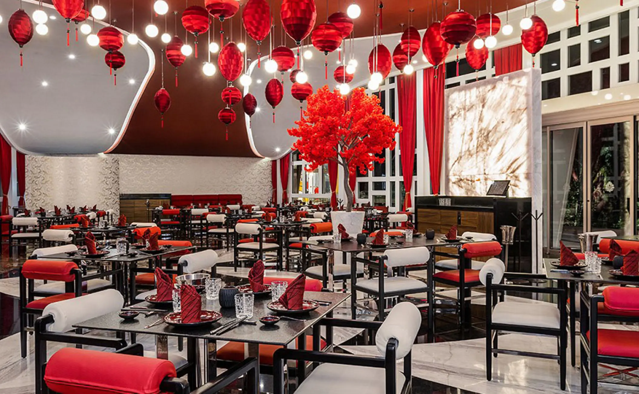 Dao restaurant interior with red lanterns and modern seating at Hotel Mousai, Puerto Vallarta