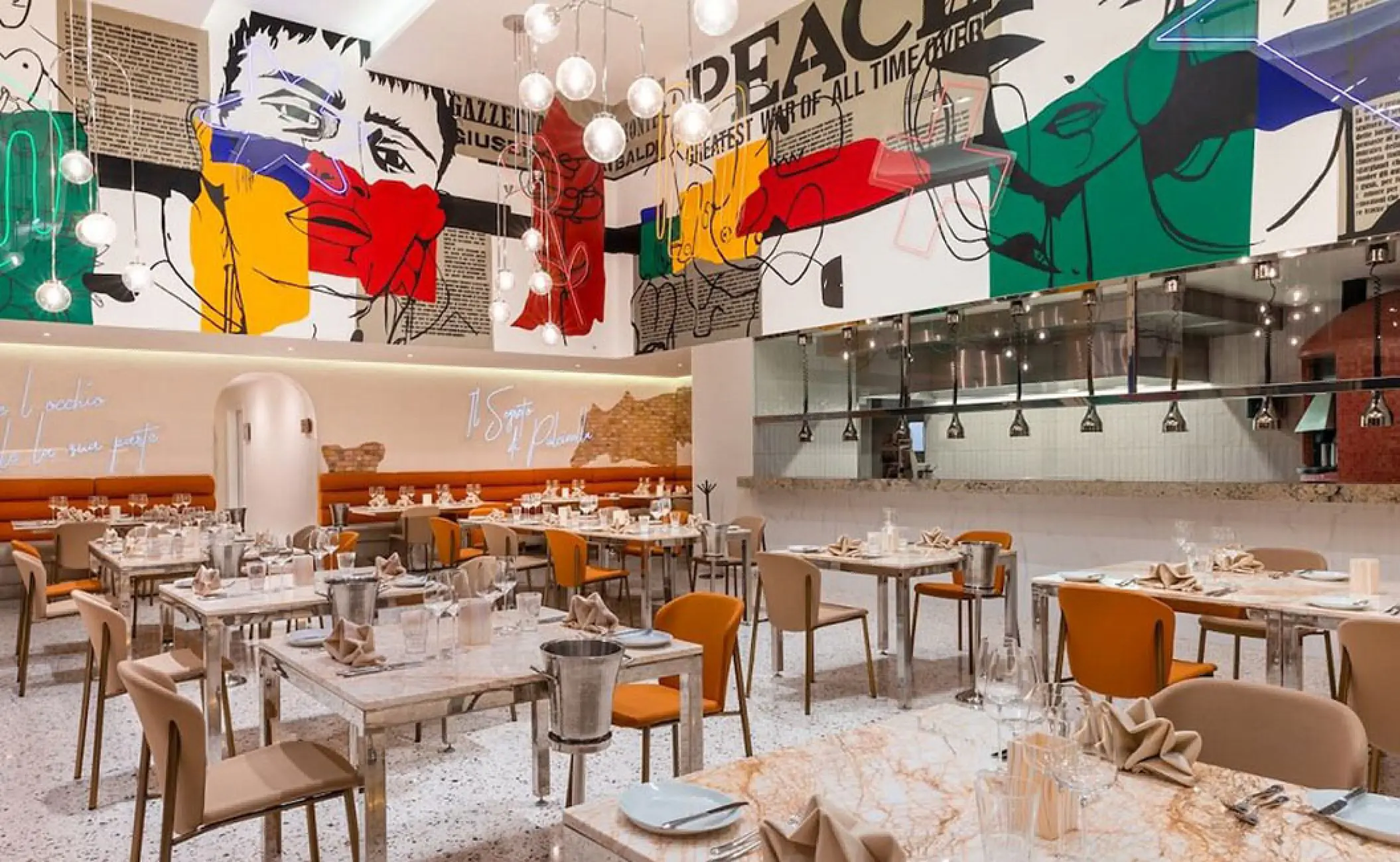 Modern Noi restaurant with colorful pop art murals and pendant lighting at Hotel Mousai, Puerto Vallarta