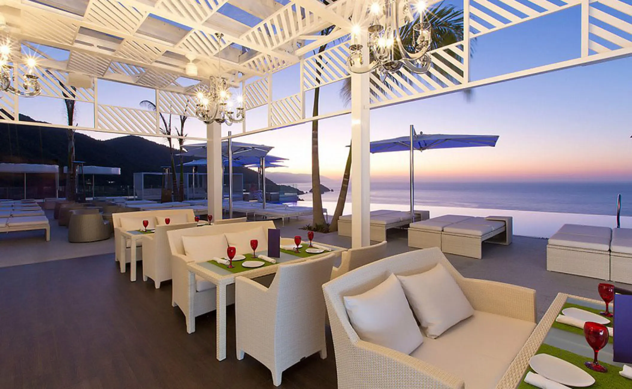 The Rooftop North open-air restaurant at Hotel Mousai overlooking the ocean at sunset, Puerto Vallarta