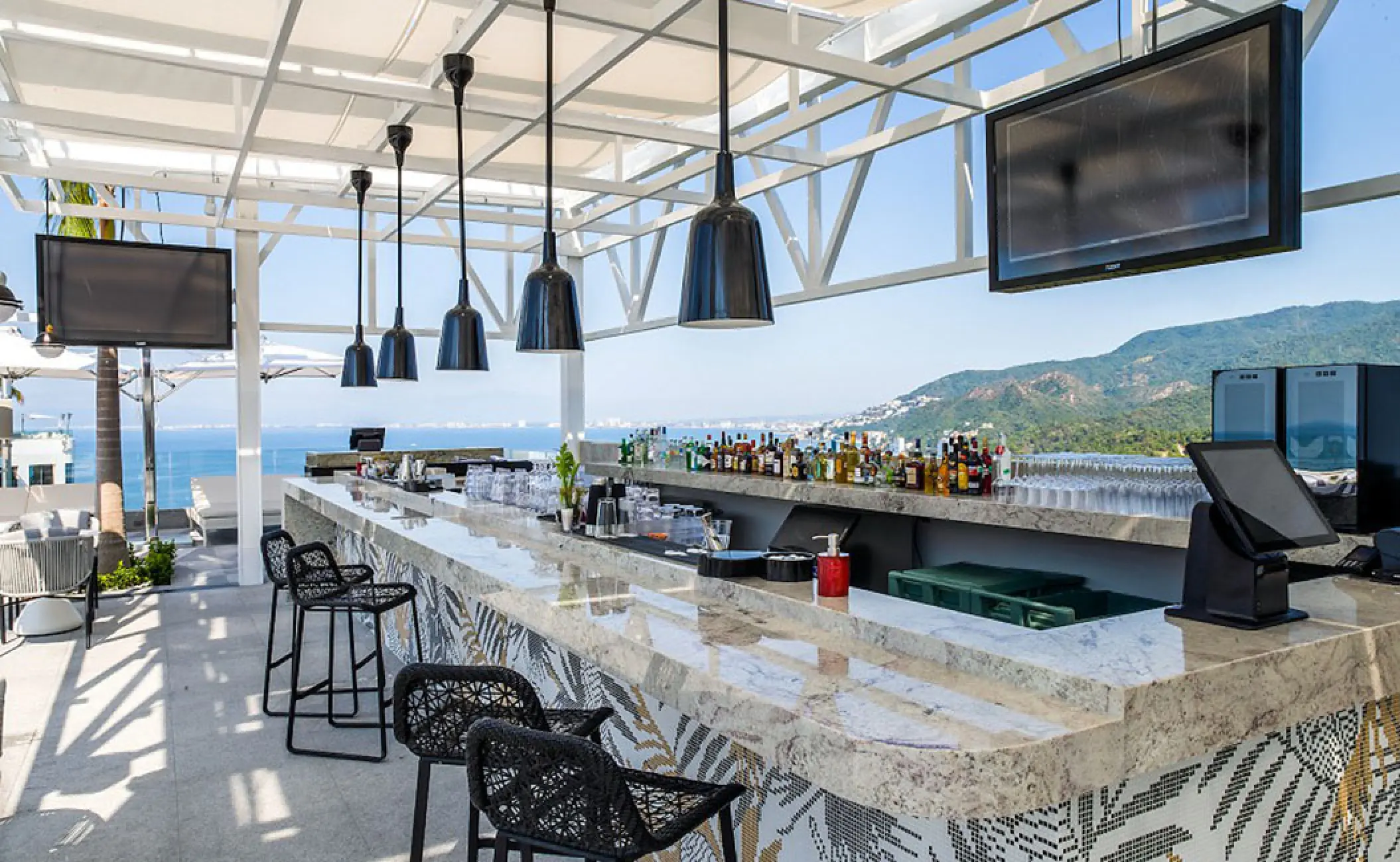The Rooftop South bar at Hotel Mousai Puerto Vallarta with ocean and mountain views