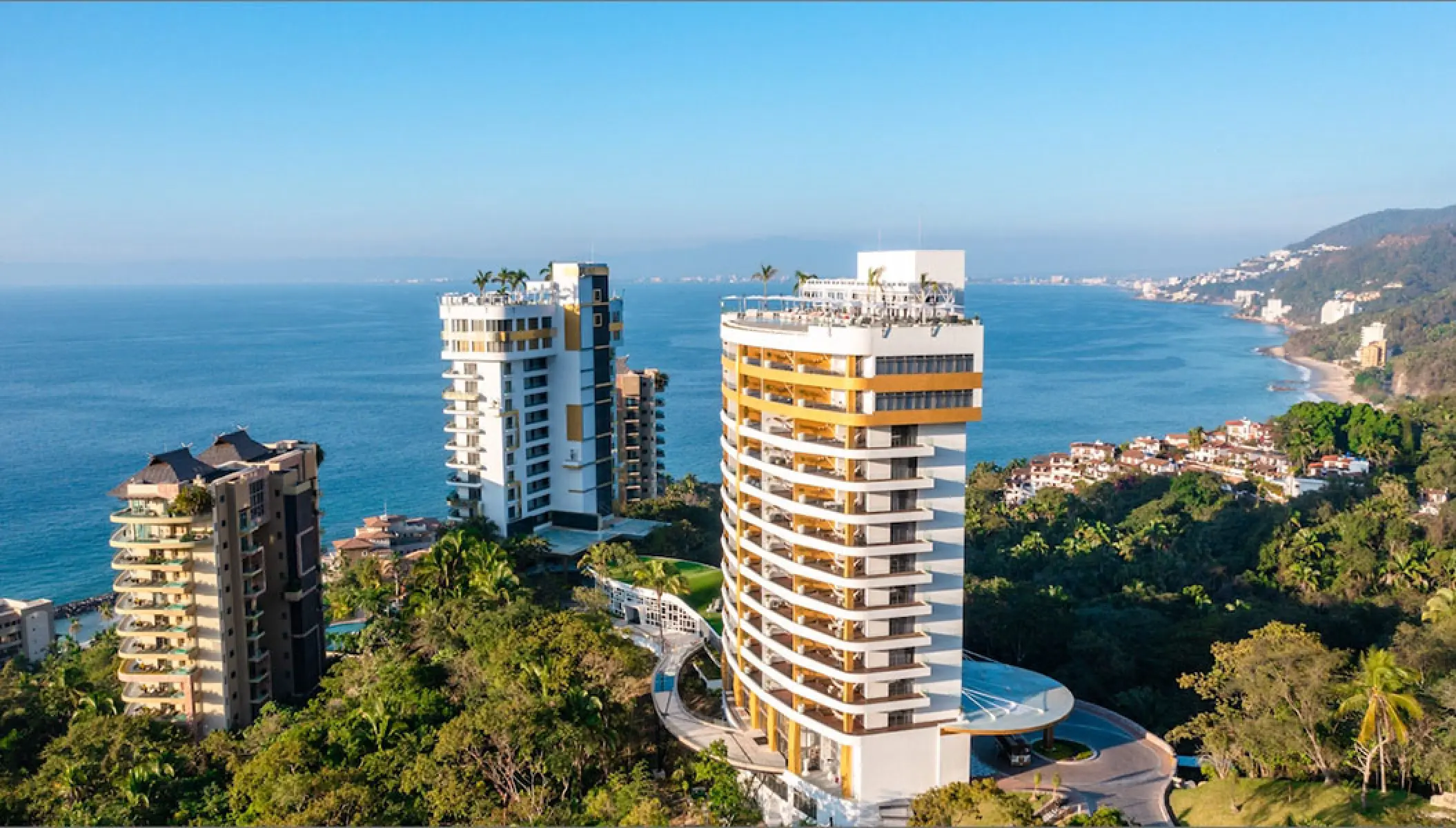 Hotel Mousai towers overlooking the Pacific Ocean coastline, Puerto Vallarta