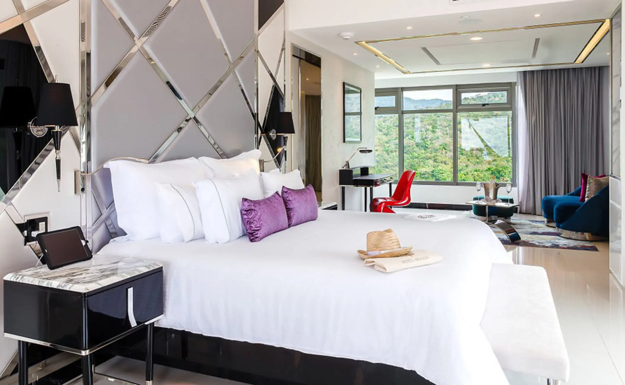 South Corner Suite with jungle views and purple accents at Hotel Mousai, Puerto Vallarta