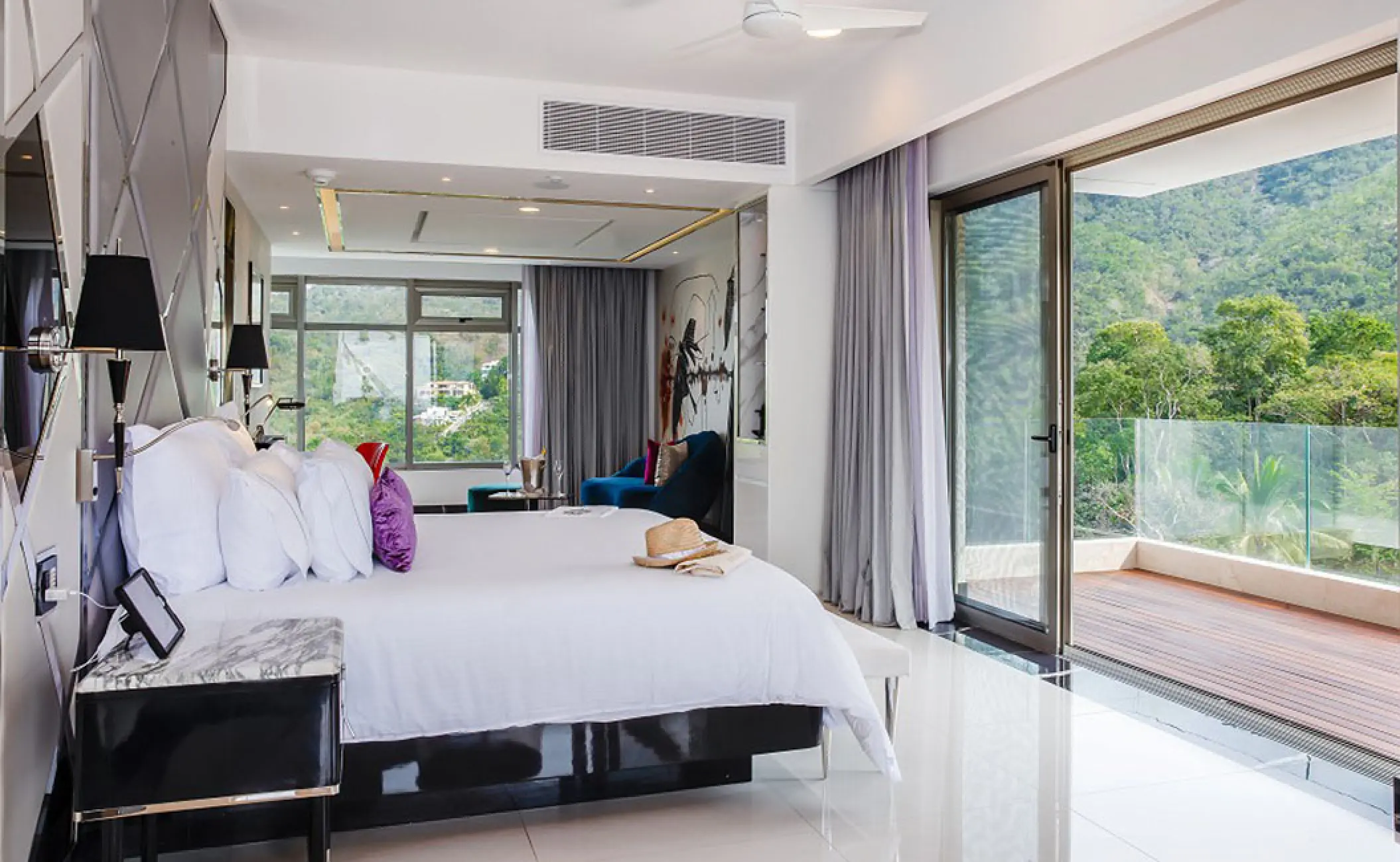 South corner suite with a private balcony overlooking the jungle at Hotel Mousai, Puerto Vallarta