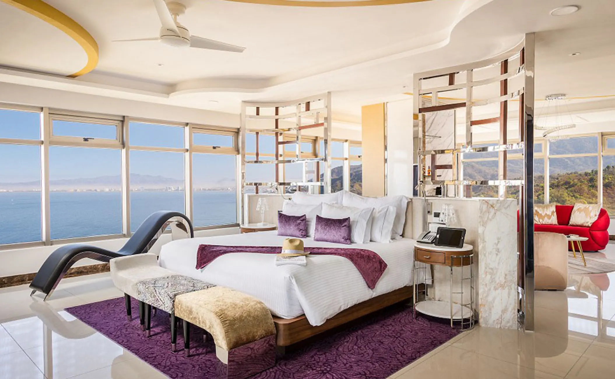 Master suite with floor-to-ceiling ocean views and purple accents at Hotel Mousai, Puerto Vallarta