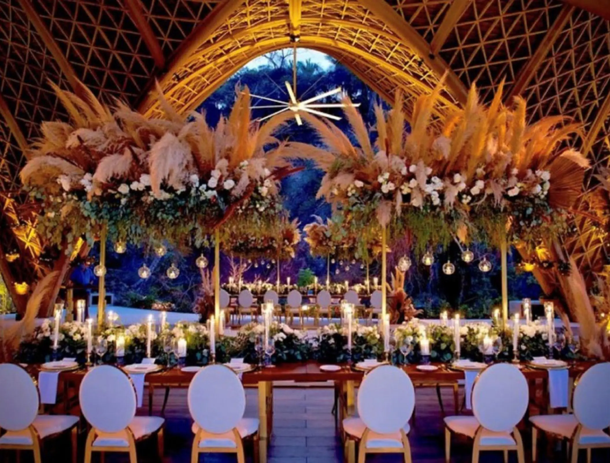 Wedding reception setup with pampas grass and candles at Garza Blanca Preserve, Puerto Vallarta
