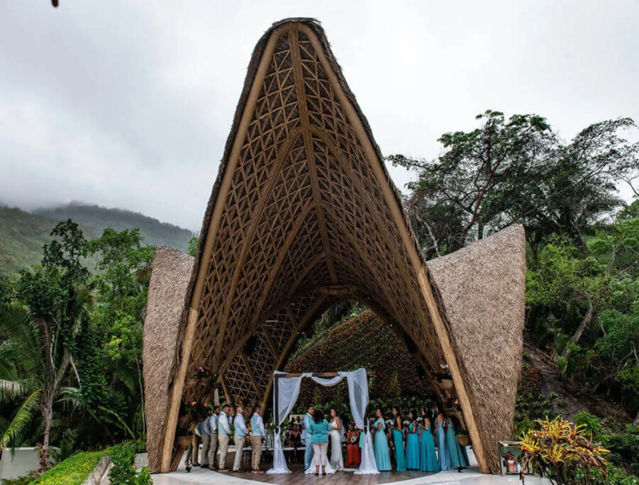 Wedding ceremony under a thatched bamboo pavilion at Garza Blanca Puerto Vallarta