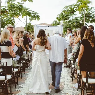 Bride walking down the aisle at Garza Blanca Puerto Vallarta