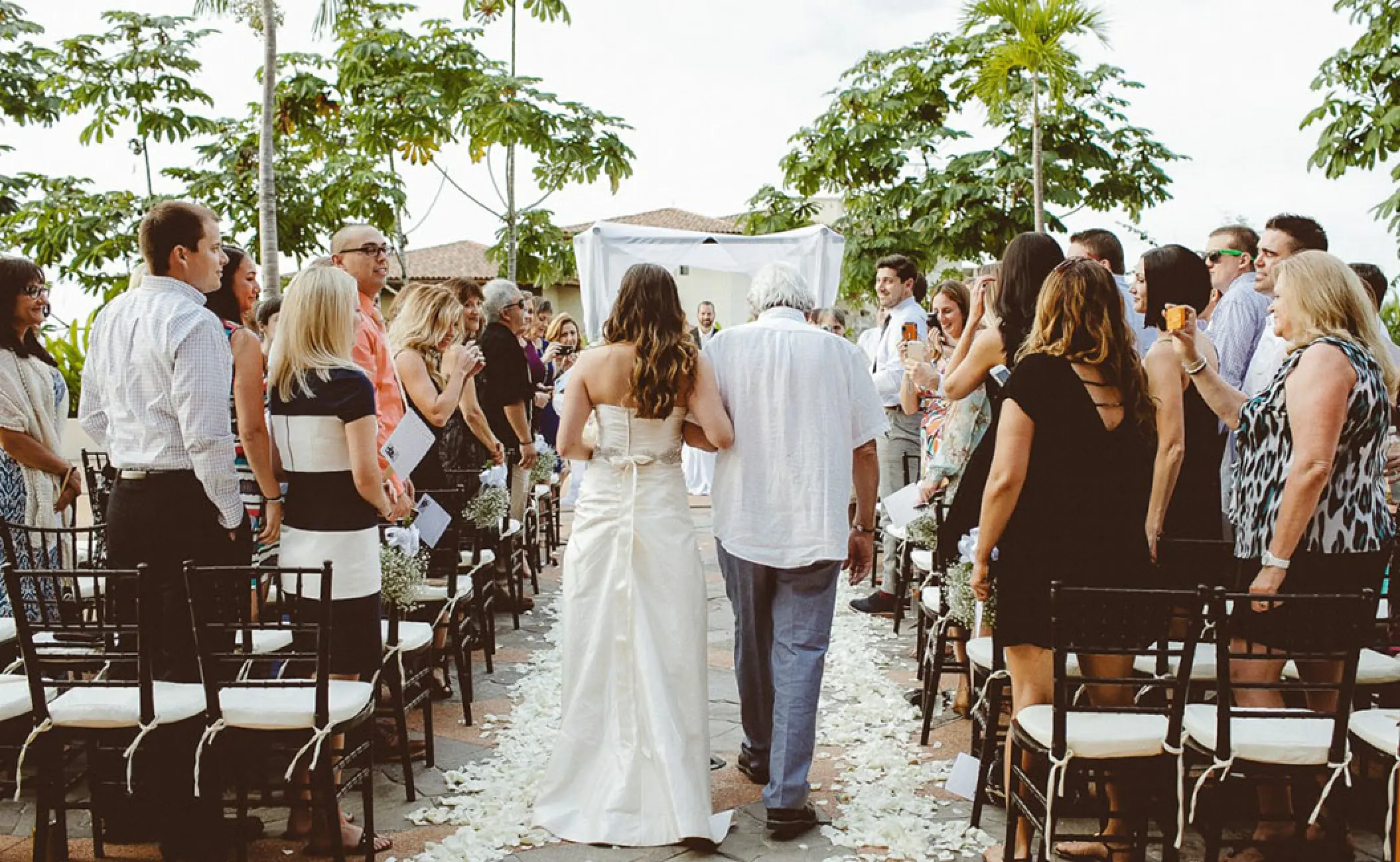 Bride walking down the aisle at Hotel Mousai, Puerto Vallarta