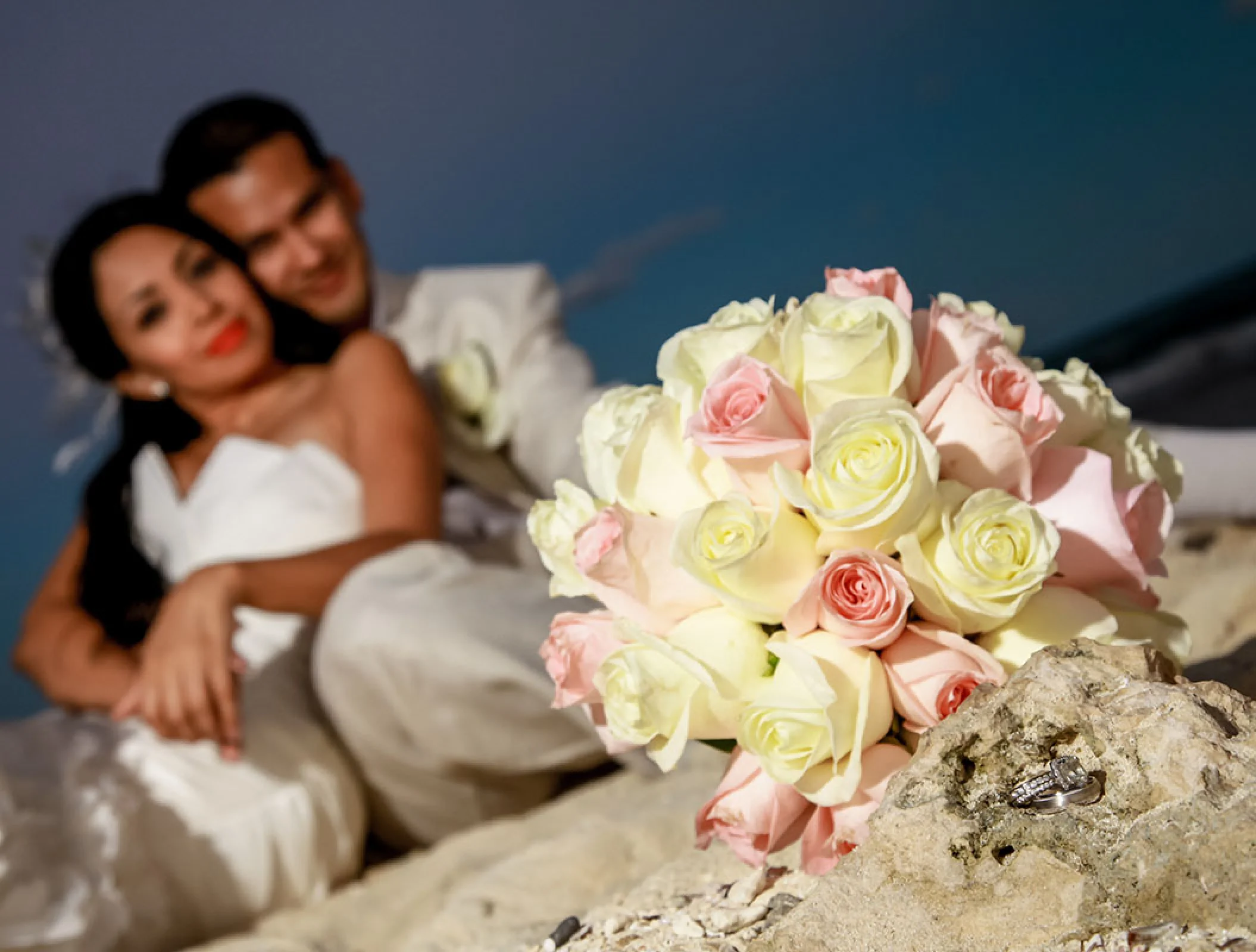Groom and bride on the beach at Hilton Tulum.