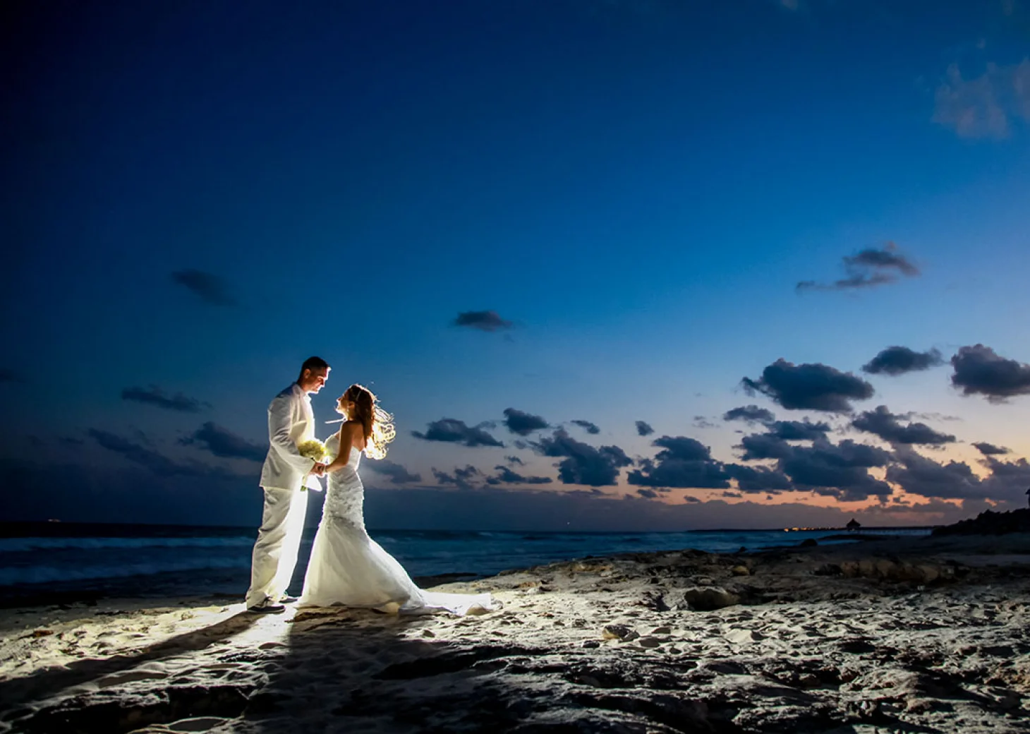 Couple at Beach Stage wedding venue at Hilton Tulum.