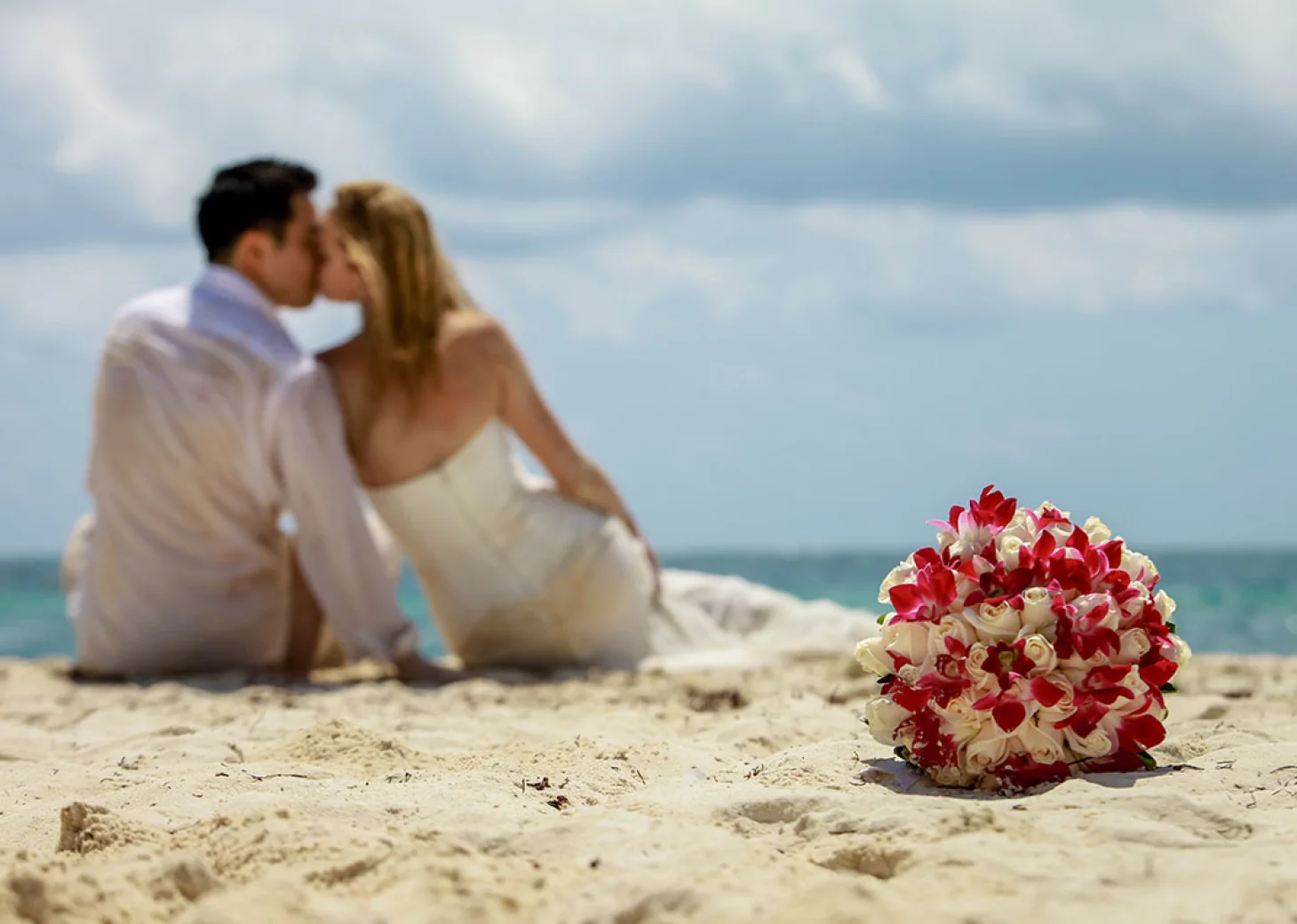Groom and Bride on the beach at Hilton Tulum.