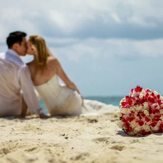 Groom and Bride on the beach at Hilton Tulum.