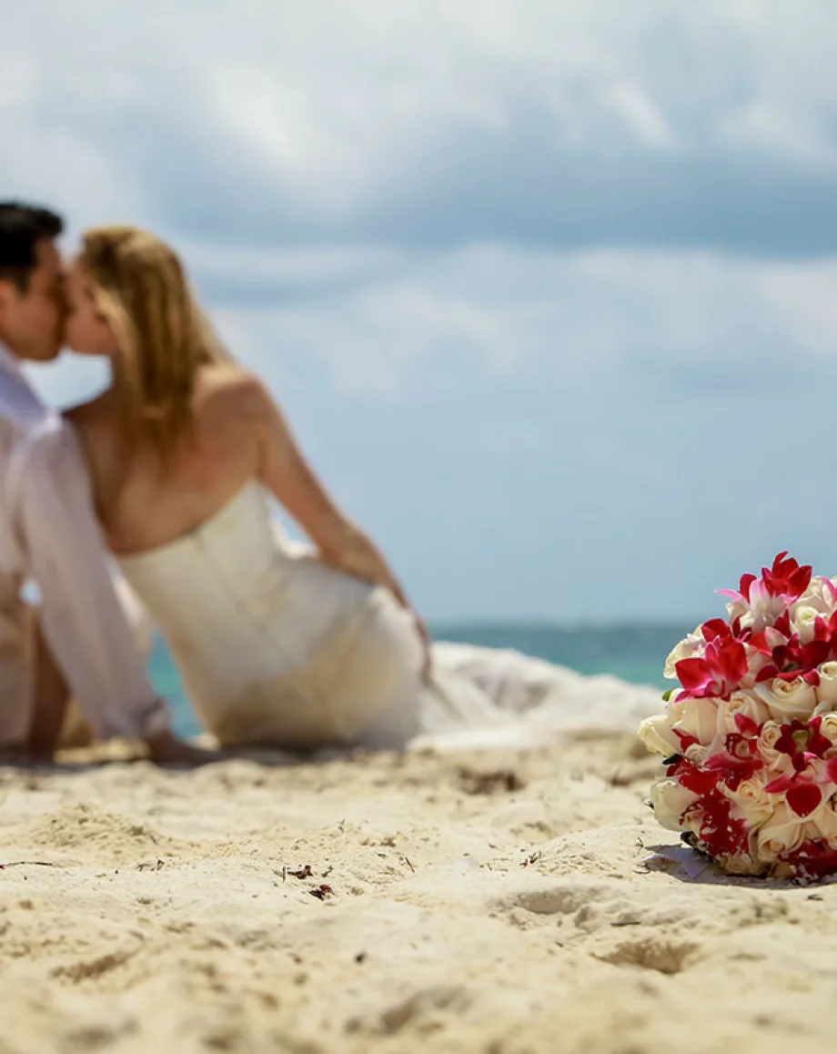 Groom and Bride on the beach at Hilton Tulum.