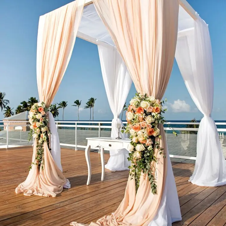 Sky terrace wedding ceremony setup with floral arch at Nickelodeon Punta Cana