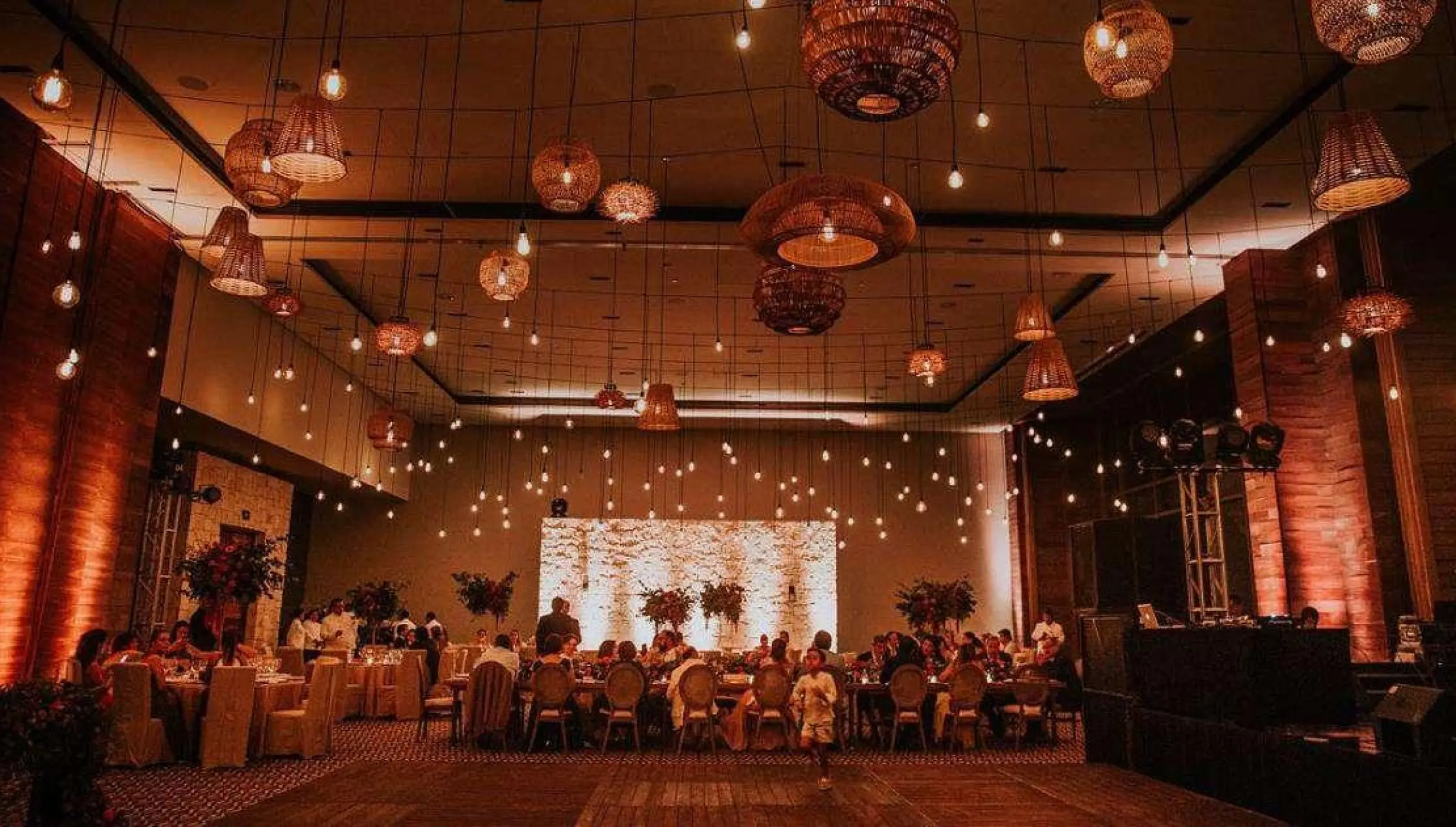 Sian Ka’an ballroom wedding reception with hanging woven lanterns at Nizuc Resort, Cancun