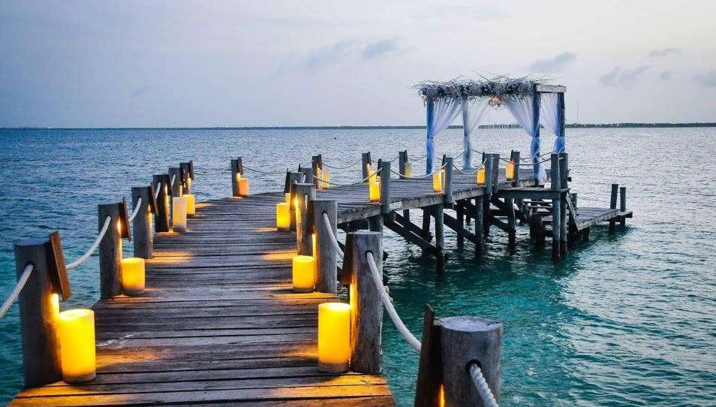 Ceremony decor on The pier wedding venue at Nizuc Resort and Spa