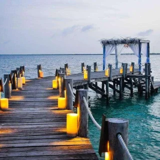 Ceremony decor on The pier wedding venue at Nizuc Resort and Spa
