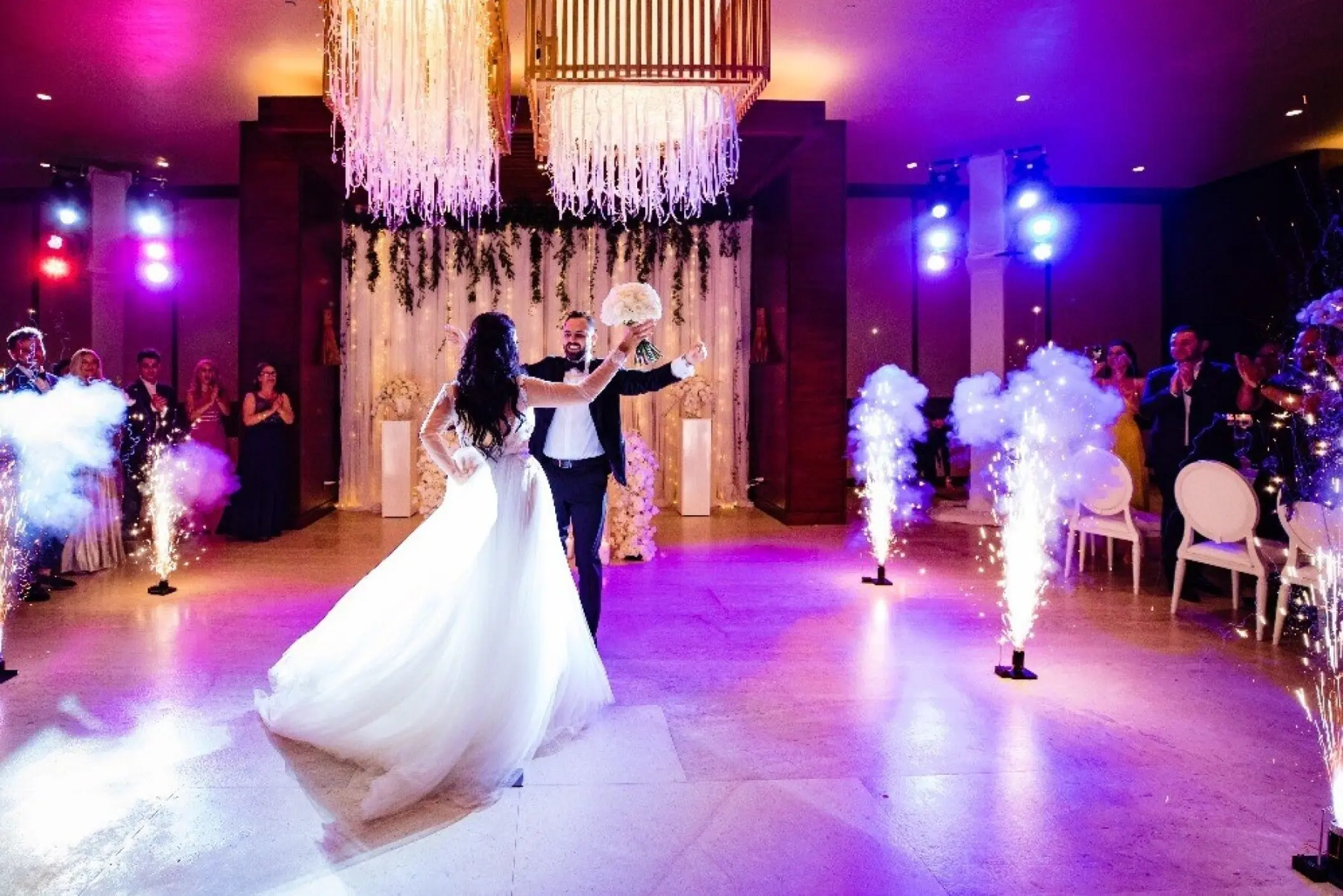 First dance in a ballroom with sparklers and purple lighting at Nobu Hotel Los Cabos, Cabo San Lucas