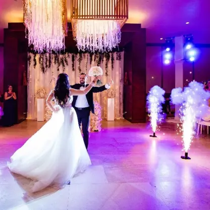 First dance in a ballroom with sparklers and purple lighting at Nobu Hotel Los Cabos, Cabo San Lucas