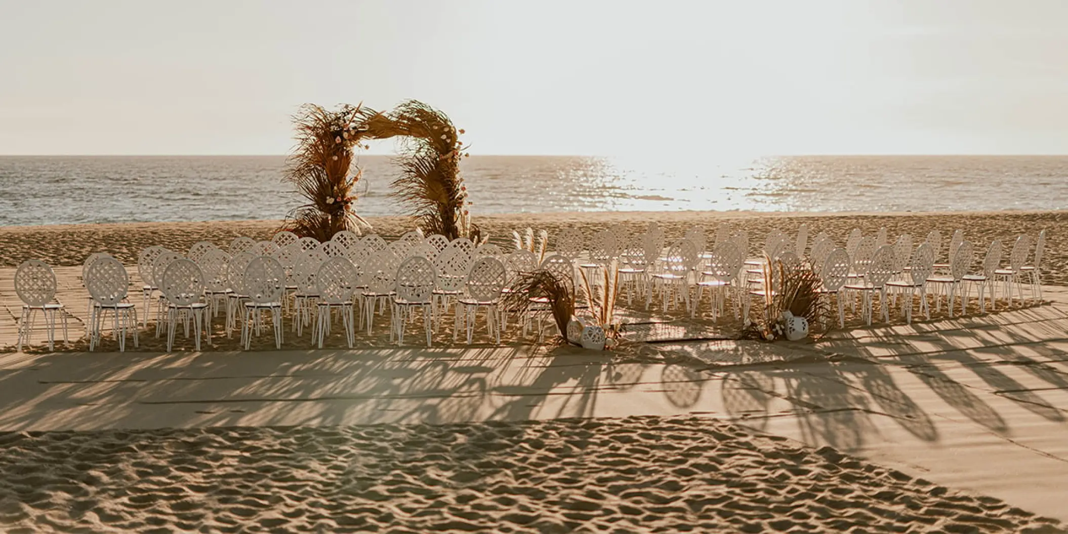 Beachfront wedding ceremony setup at Nobu Los Cabos, Cabo San Lucas