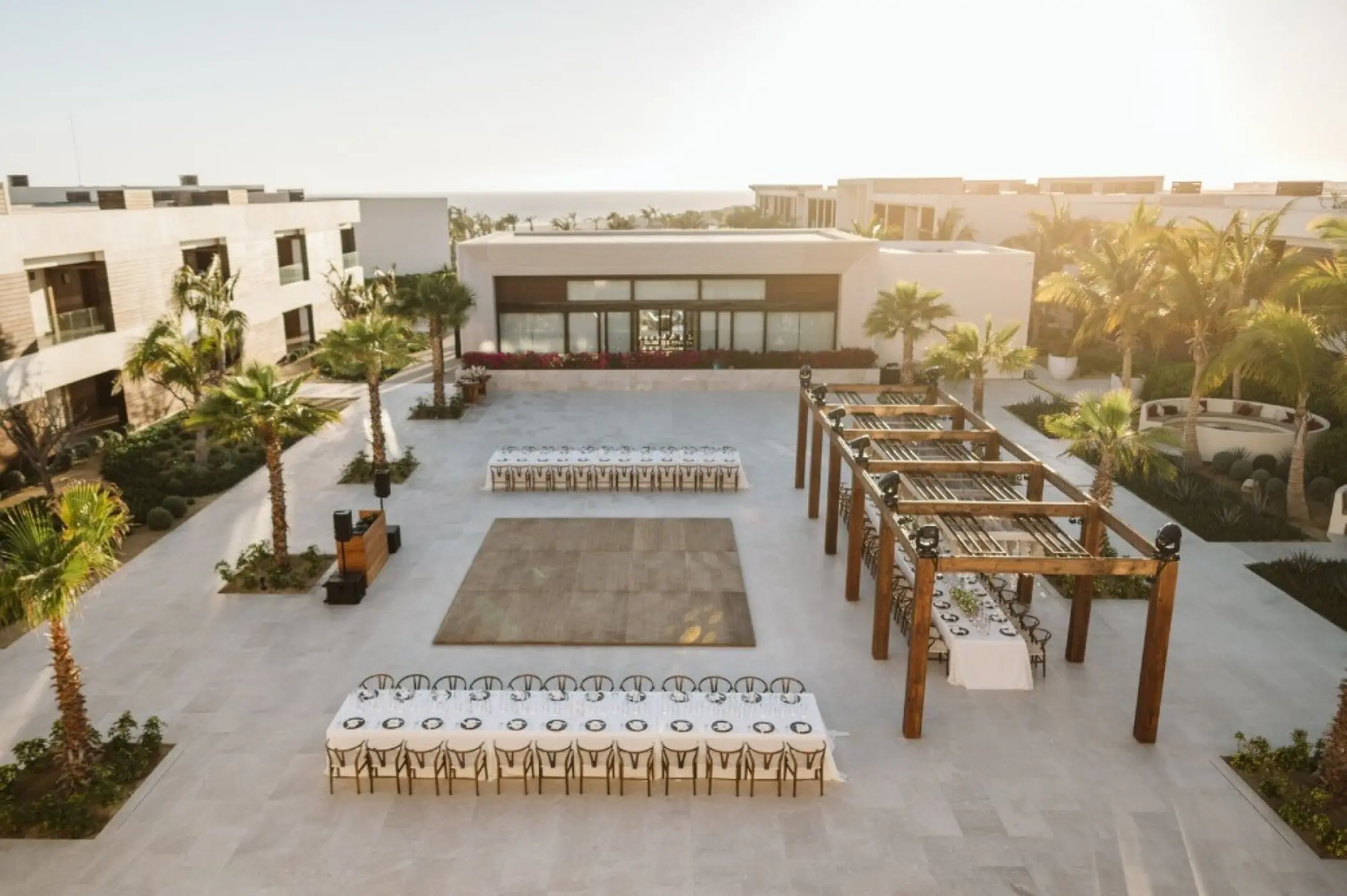 Outdoor wedding reception setup with dance floor on the Shiawase Terrace at Nobu Hotel, Cabo San Lucas