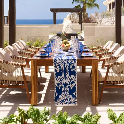 Outdoor wedding reception table with blue and white runner at Nobu Los Cabos, Cabo San Lucas
