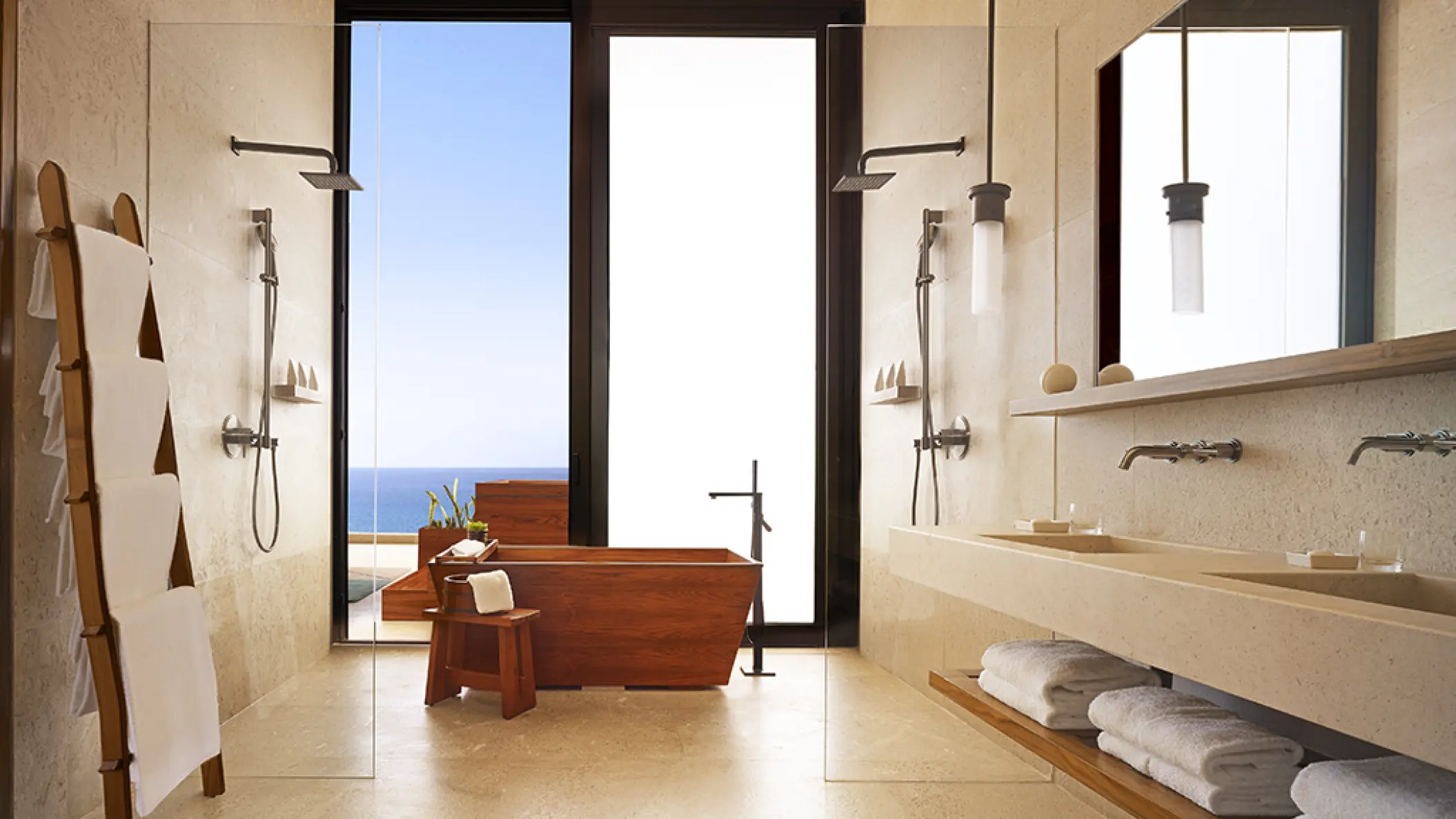 Modern suite bathroom with wooden soaking tub and ocean view at Nobu Hotel Los Cabos, Cabo San Lucas