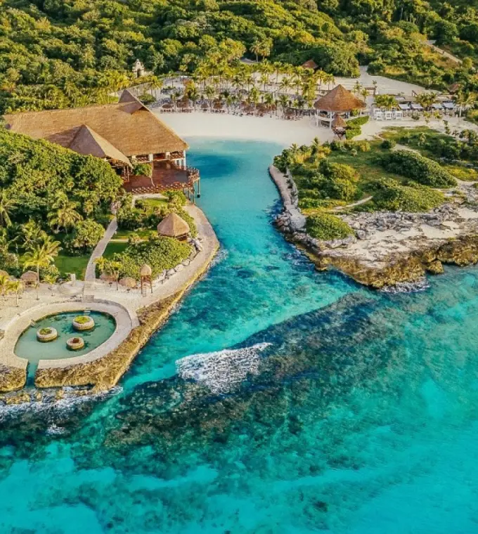 Aerial view of the private cove and turquoise ocean at Occidental at Xcaret Destination, Playa Del Carmen