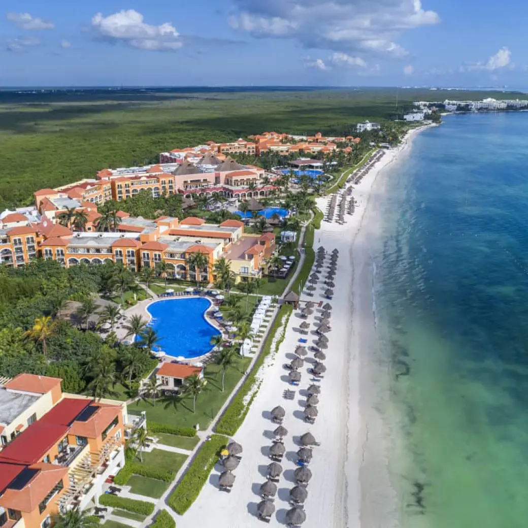 Aerial view of Ocean Coral & Turquesa resort grounds, pools and beachfront, Riviera Maya
