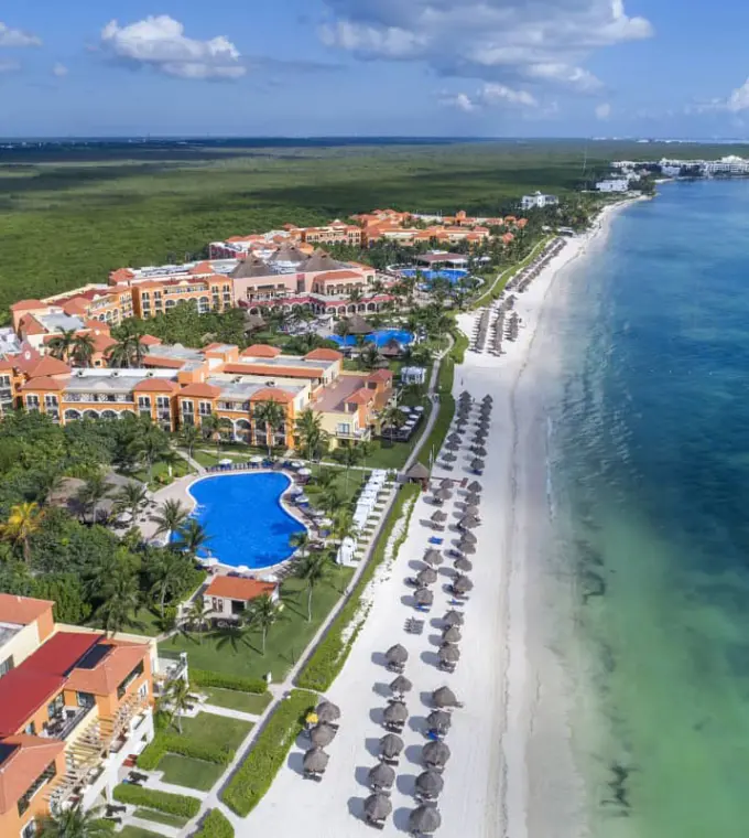 Aerial view of Ocean Coral & Turquesa resort grounds, pools and beachfront, Riviera Maya