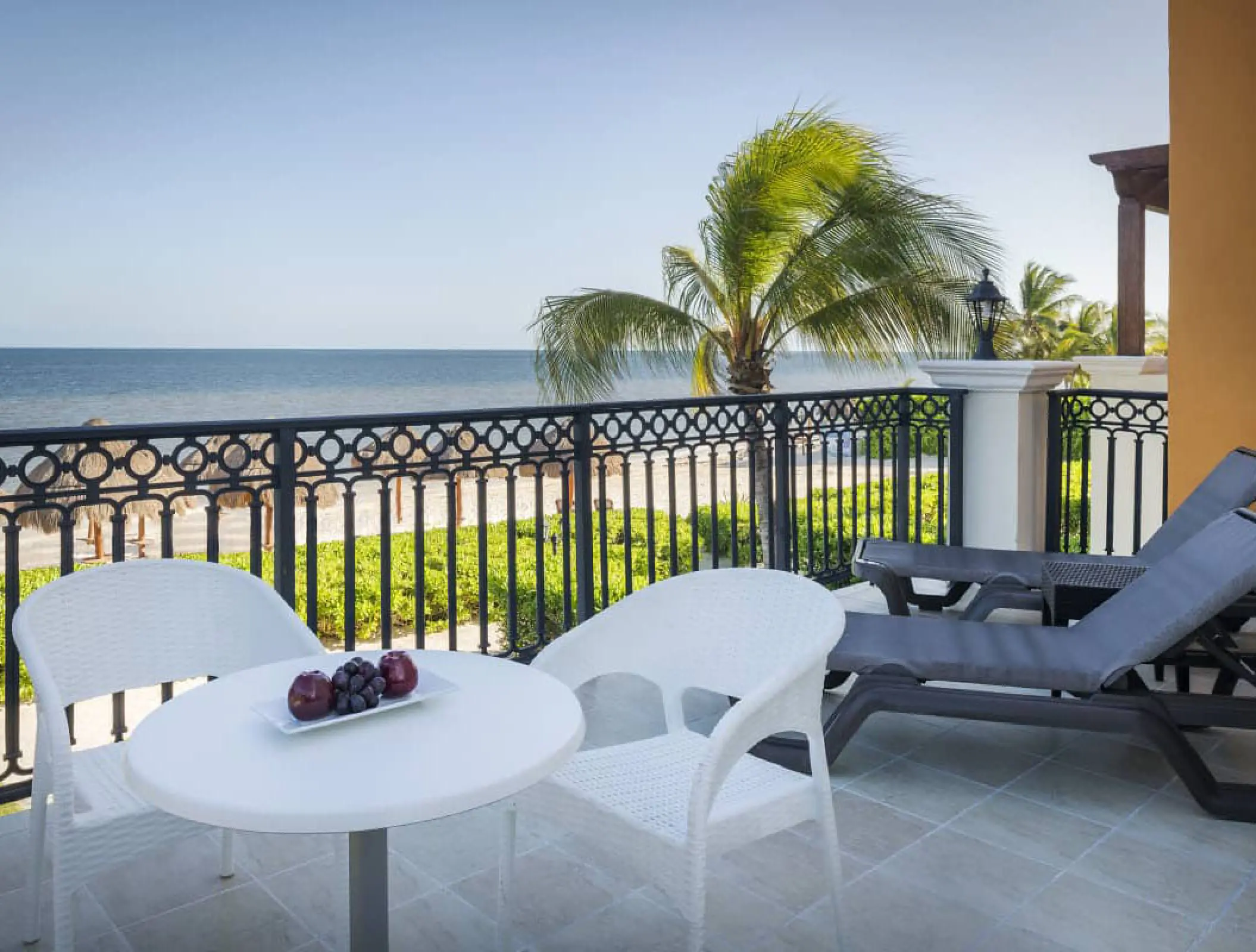 Private suite balcony with ocean views and lounge chairs at H10 Ocean Coral & Turquesa, Riviera Maya