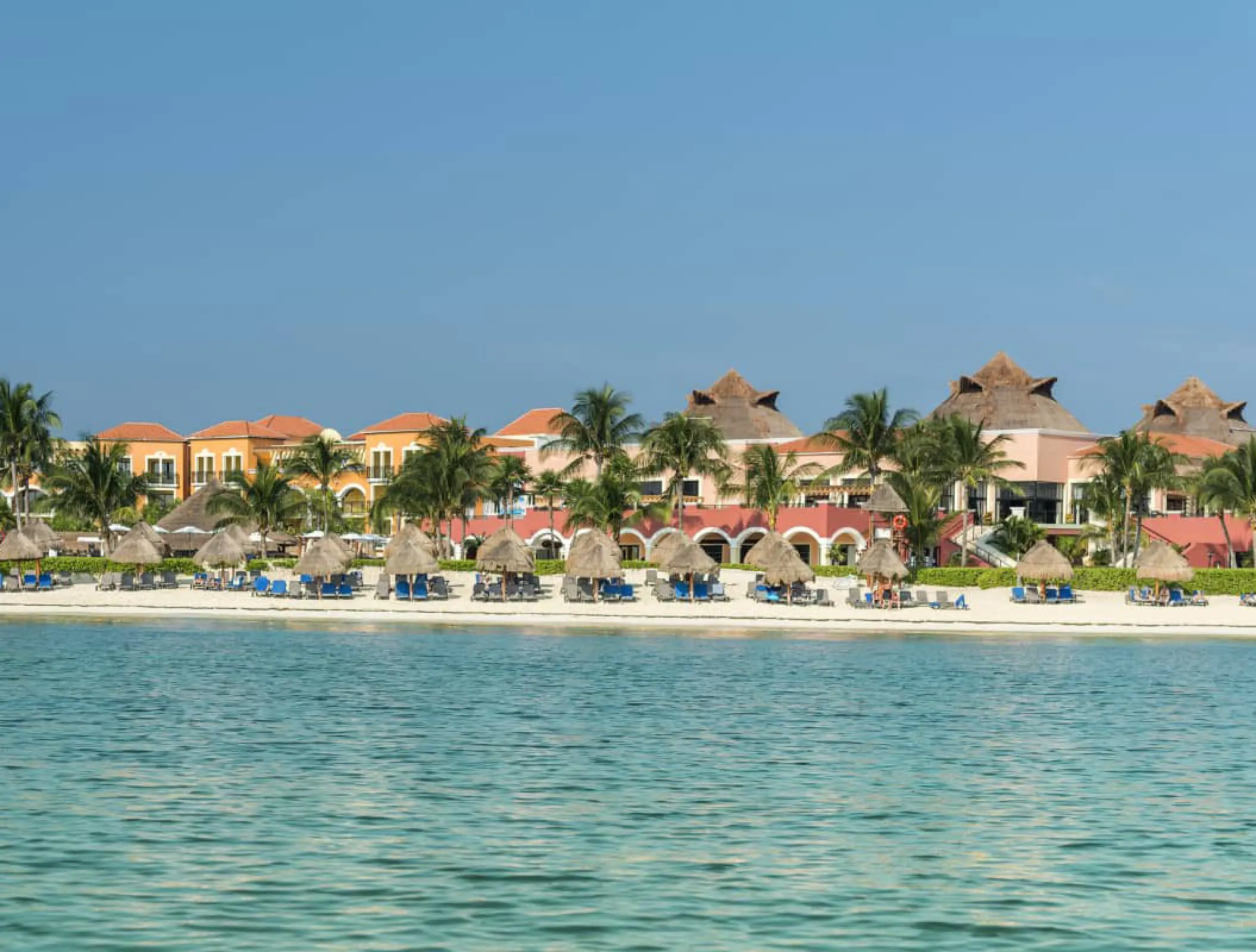 Ocean Coral & Turquesa beachfront with palapas and palm trees, Riviera Maya