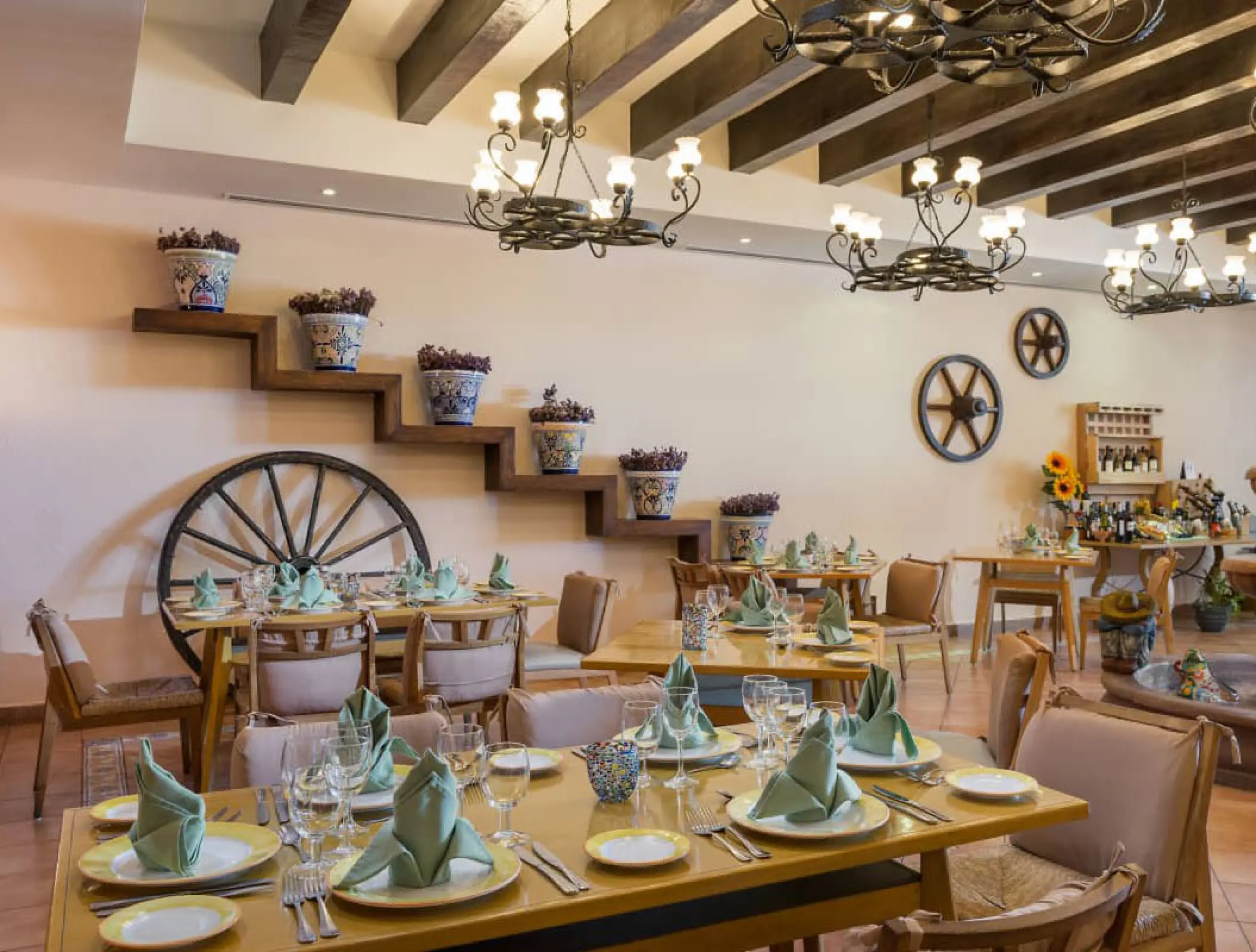Indoor restaurant dining tables with rustic decor at Ocean Coral & Turquesa, Riviera Maya