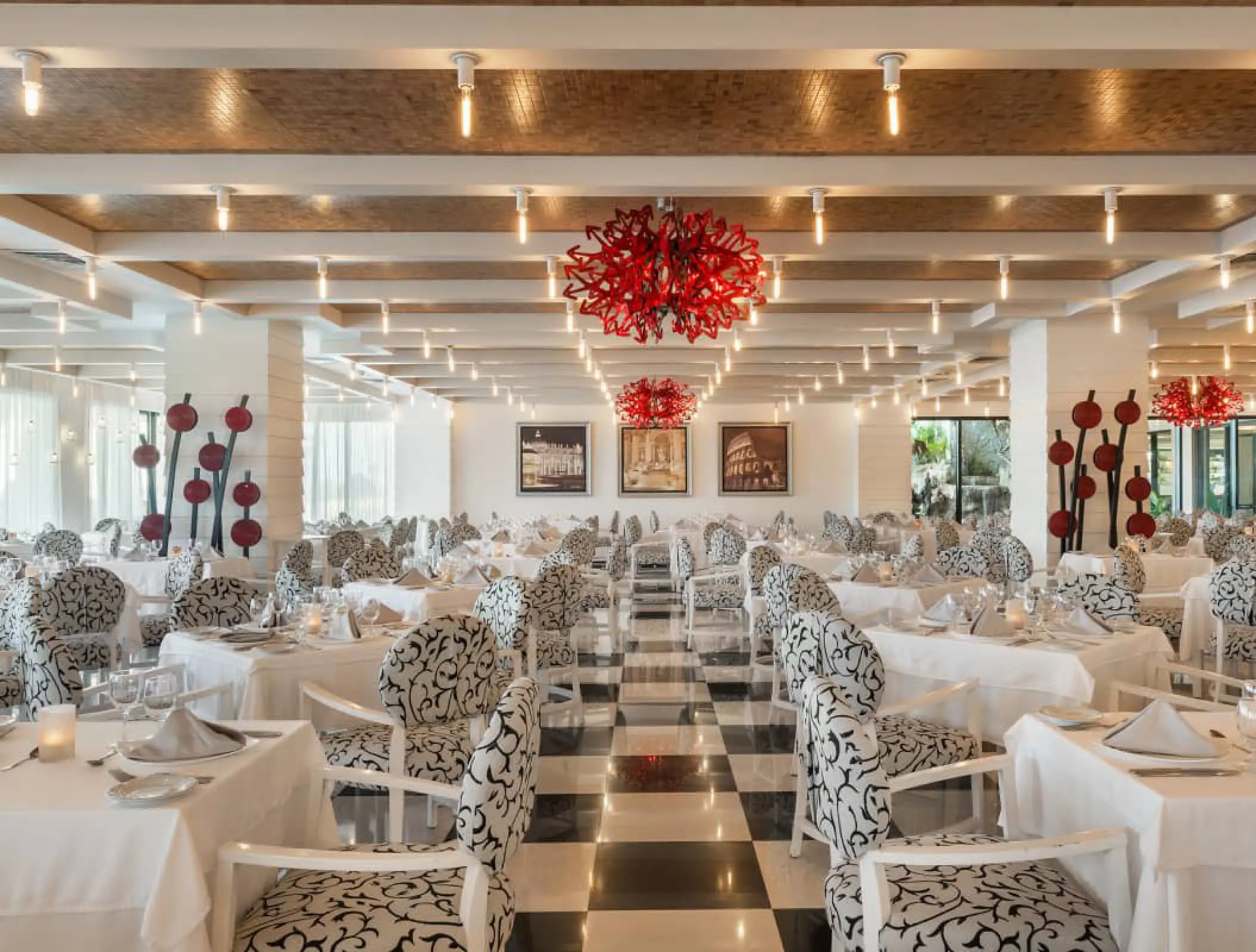 Modern restaurant dining room with checkered floors at Ocean Coral & Turquesa, Riviera Maya