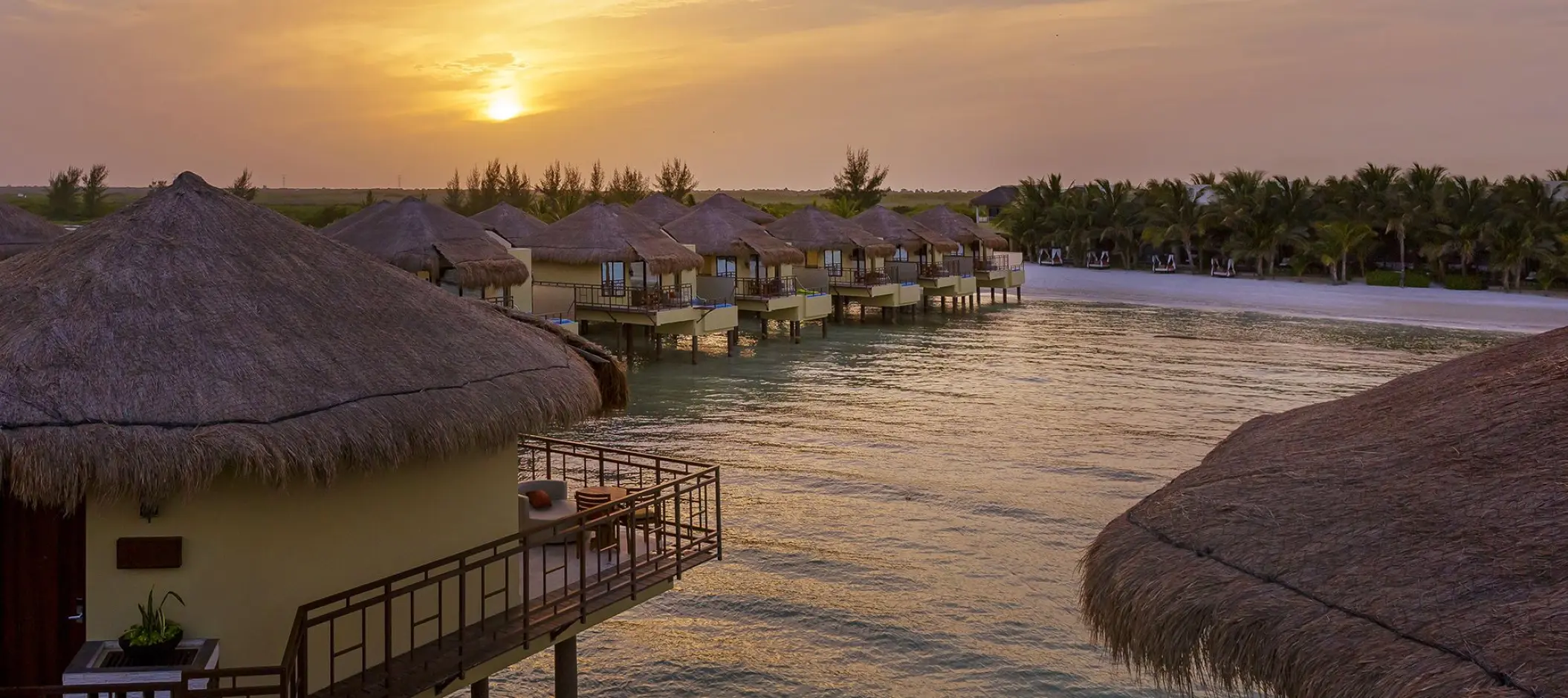 El Dorado Palafitos overwater bungalows at sunset, Riviera Maya
