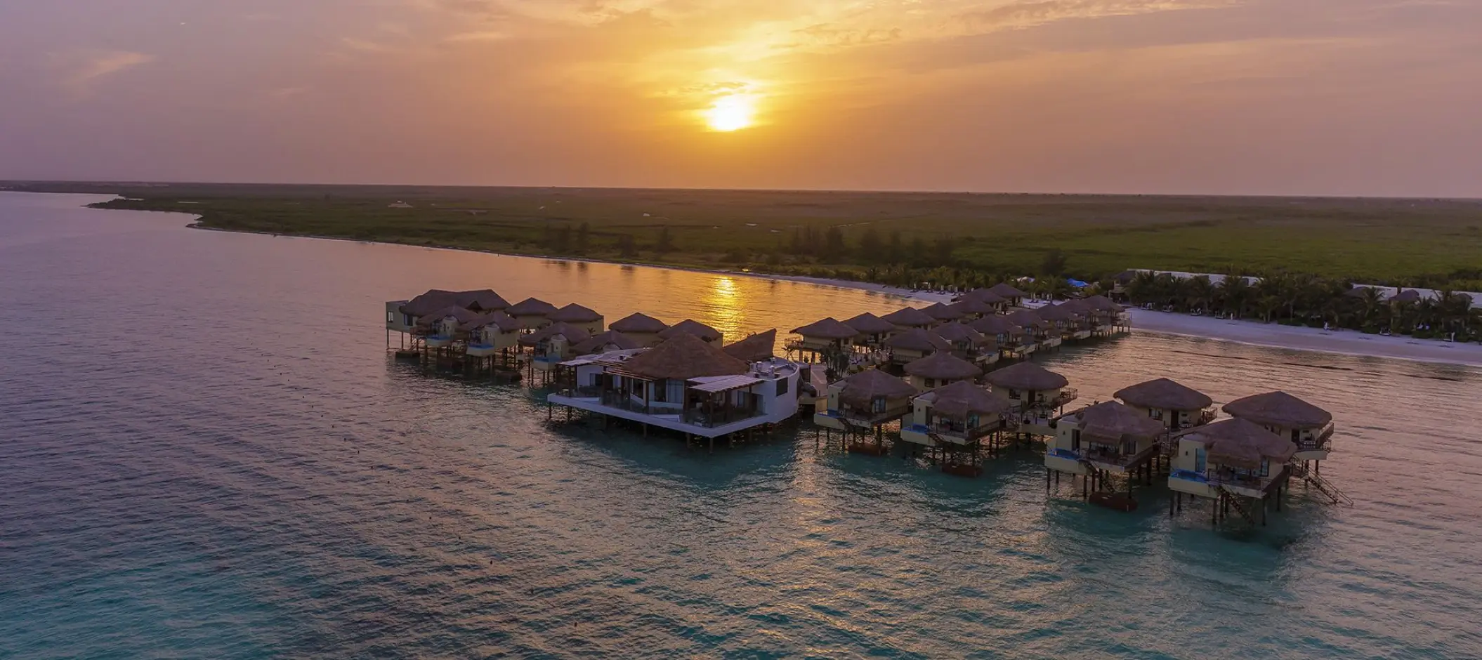 Aerial view of El Dorado Palafitos overwater bungalows at sunset, Riviera Maya