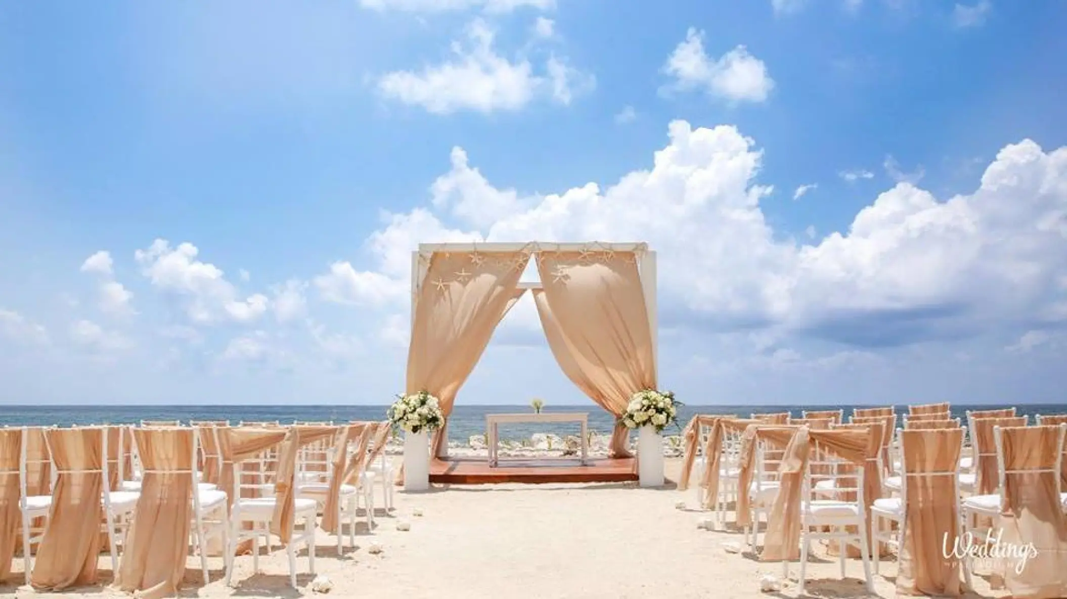 Beachfront wedding ceremony setup at Grand Palladium Costa Mujeres, Cancun