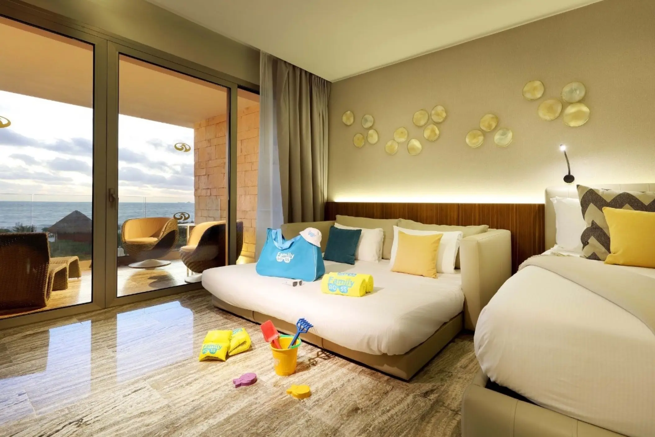 Family suite with ocean view balcony and beach toys at Grand Palladium Costa Mujeres, Cancun