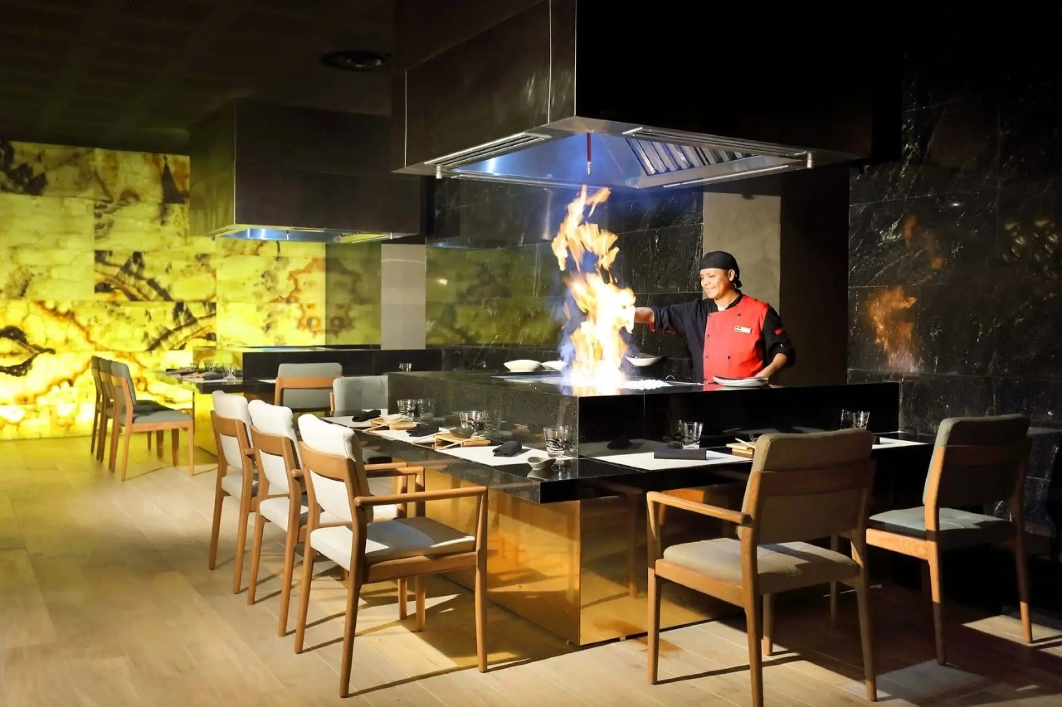 Chef preparing a flambé meal at the Sumptuori teppanyaki restaurant, Grand Palladium Costa Mujeres