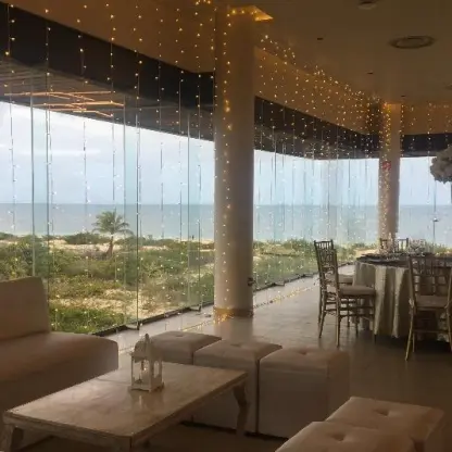 Poseidon Terrace reception setup with string lights at Grand Palladium Costa Mujeres, Cancun